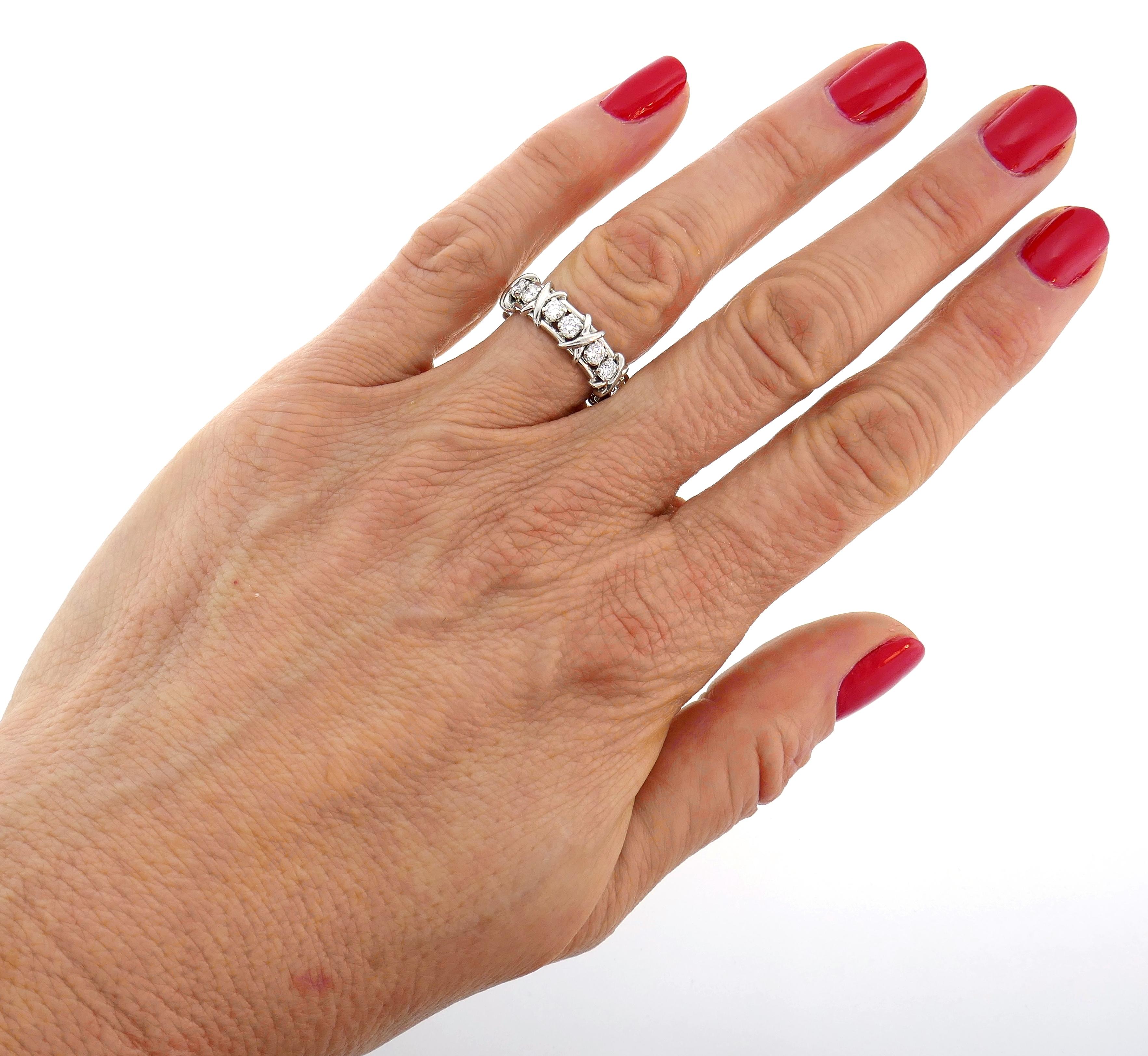 Timeless and elegant band ring created by Jean Schlumberger for Tiffany & Co. Classic design, perfect proportions. Elegant and timeless, the band is a great addition to your jewelry collection. 
The ring is made of platinum and set with sixteen