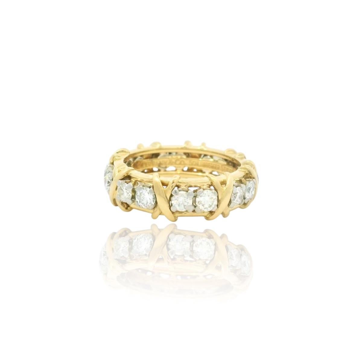 The sixteen diamond ring designed by Jean Schlumberger for Tiffany & Co. in gleaming 18 karat yellow gold. Designed in 1959, this iconic cross-stitch motif is inspired by Schlumberger's family's roots in textiles. 

Brilliant diamonds alternate with