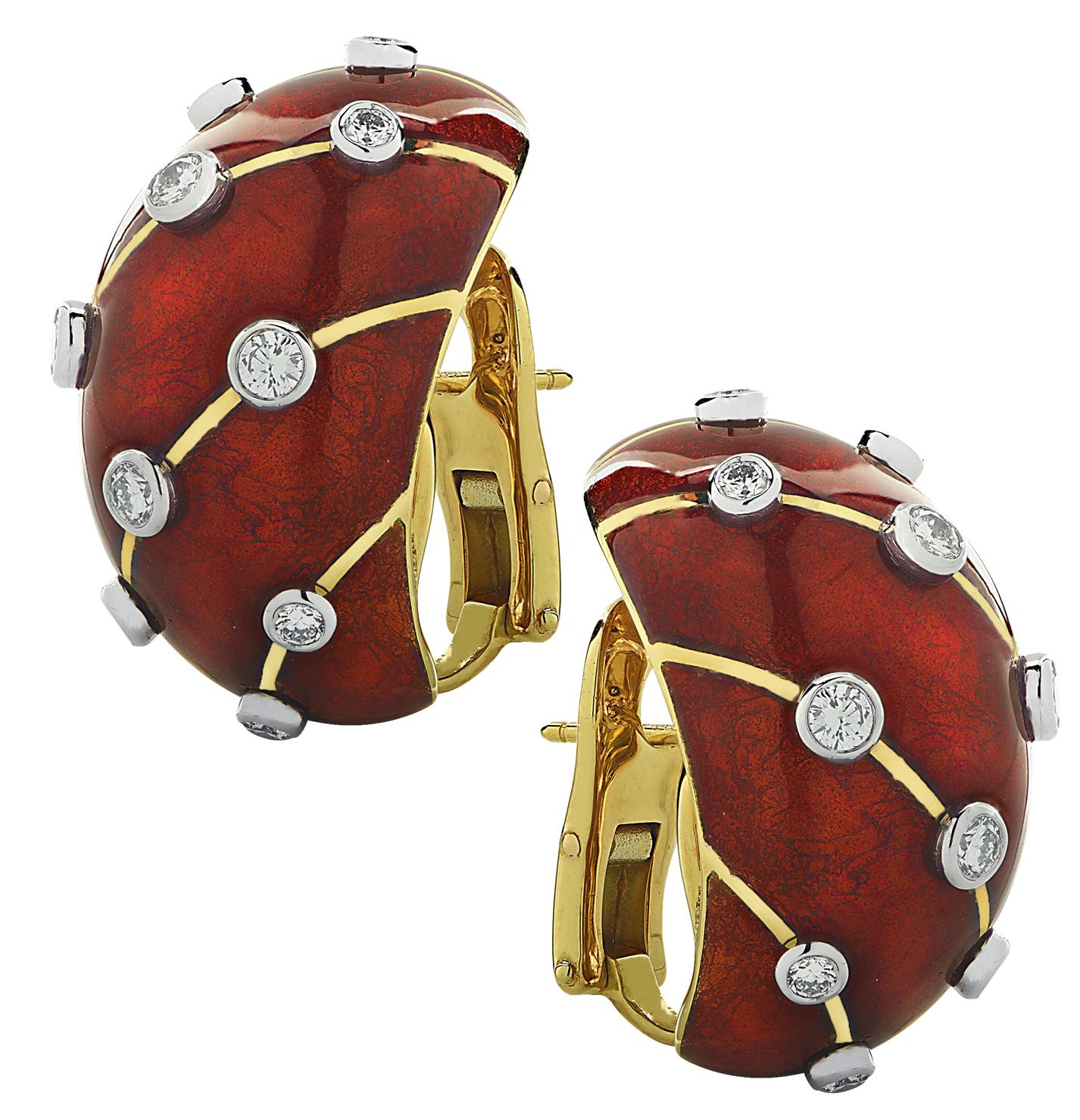 From the House of Tiffany & Co., these sensational Schlumberger Banana Earrings, finely crafted in France in 18 karat yellow and white gold with red enamel, feature 20 round brilliant cut diamonds weighing approximately 1.40 carats total, E-F color,