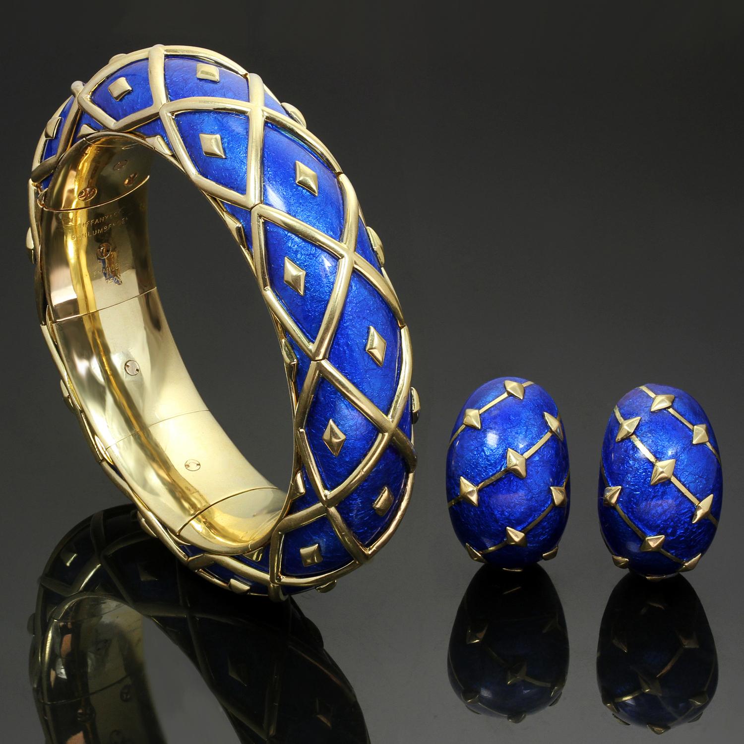 This chic set from the Dot Losagne collection by Tiffany & Co. features a bangle bracelet and a pair of matching clip-on earrings crafted in 18k yellow gold and blue enamel. Designed by Schlumberger  circa 1990s. Please see a small spot with enamel