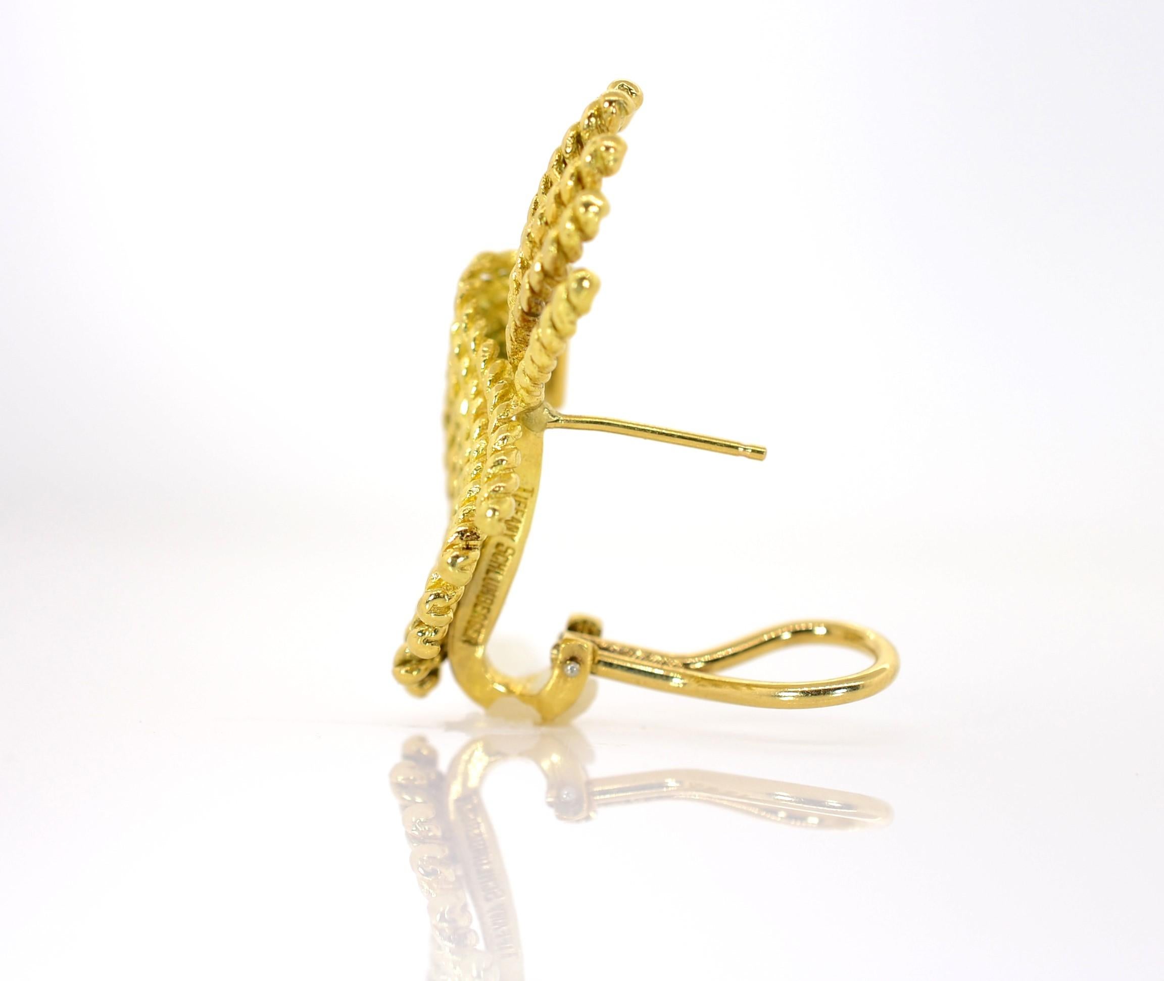 Emulating soft flapping wings these 18KT yellow gold earrings. Created by Schlumberger for Tiffany & Co, measuring 1 1/4