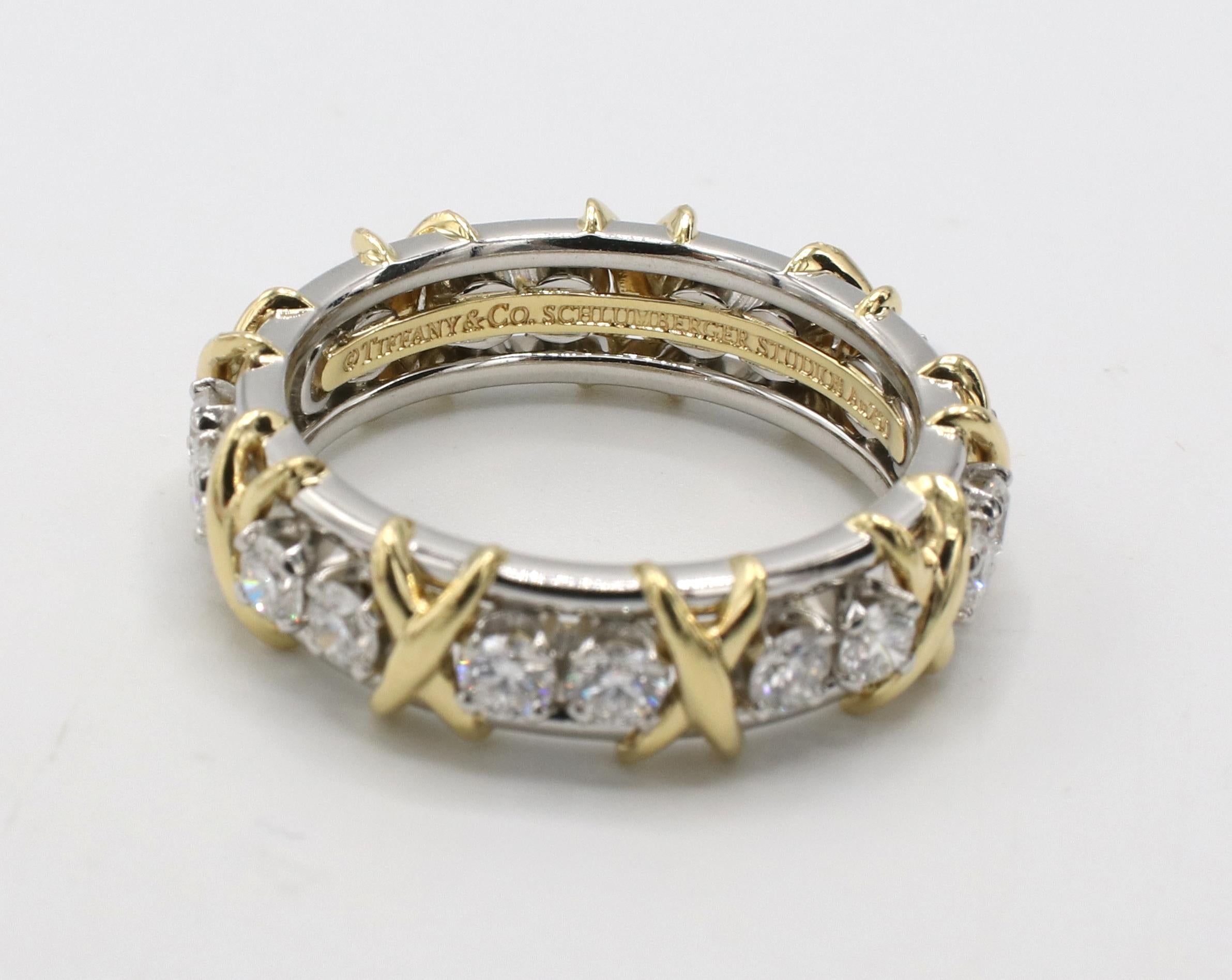 Tiffany & Co. Schlumberger Eighteen Stone Natural Diamond Ring Platinum & 18K Gold 
Metal: Platinum & 18k gold
Weight: 10.07 grams
Diamonds: 1.33 carats D-G Flawless - VS2 round natural diamonds
Size: 8.5 (US)
Width: 6.5mm
Retail: $12,900