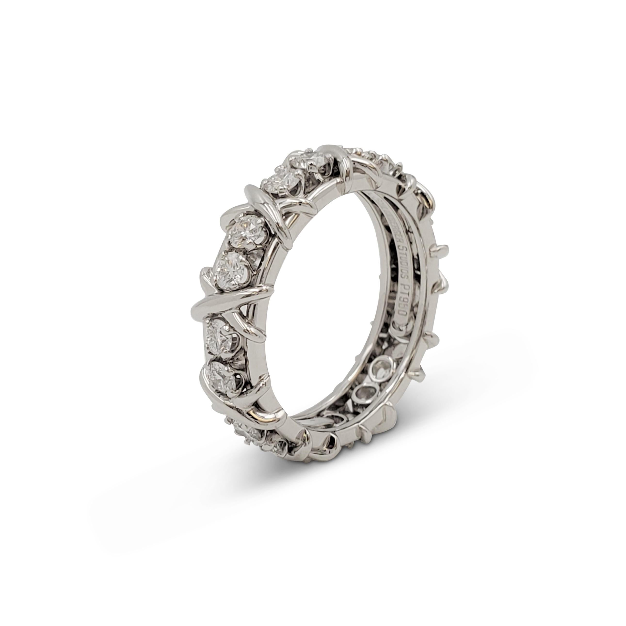 Authentic Schlumberger for Tiffany & Co. ring crafted in platinum comprised of platinum X's and eighteen sparkling round brilliant cut diamonds weighing an estimated 1.33 carats (E-F, VS). Signed Tiffany & Co. Schlumberger Studios, Au750, PT950.