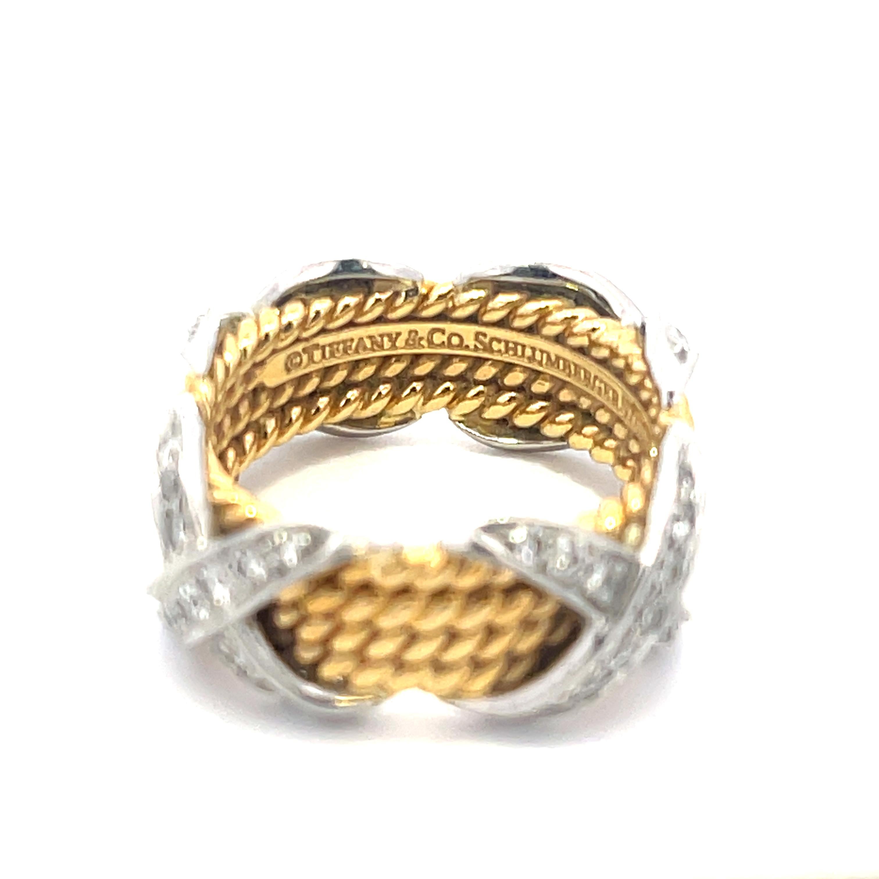 Nachlass Tiffany & Co. Schlumberger Vierreihiger X-Diamantring aus Platin und 18 Karat Gelbgold. Der Ring besteht aus ca. 0,50 ct runden Brillanten. Der Ring hat die Größe 5 1/2, wiegt 10,5 Gramm und ist 8,7 mm breit. Tiffany&Co Schlumberger Studios