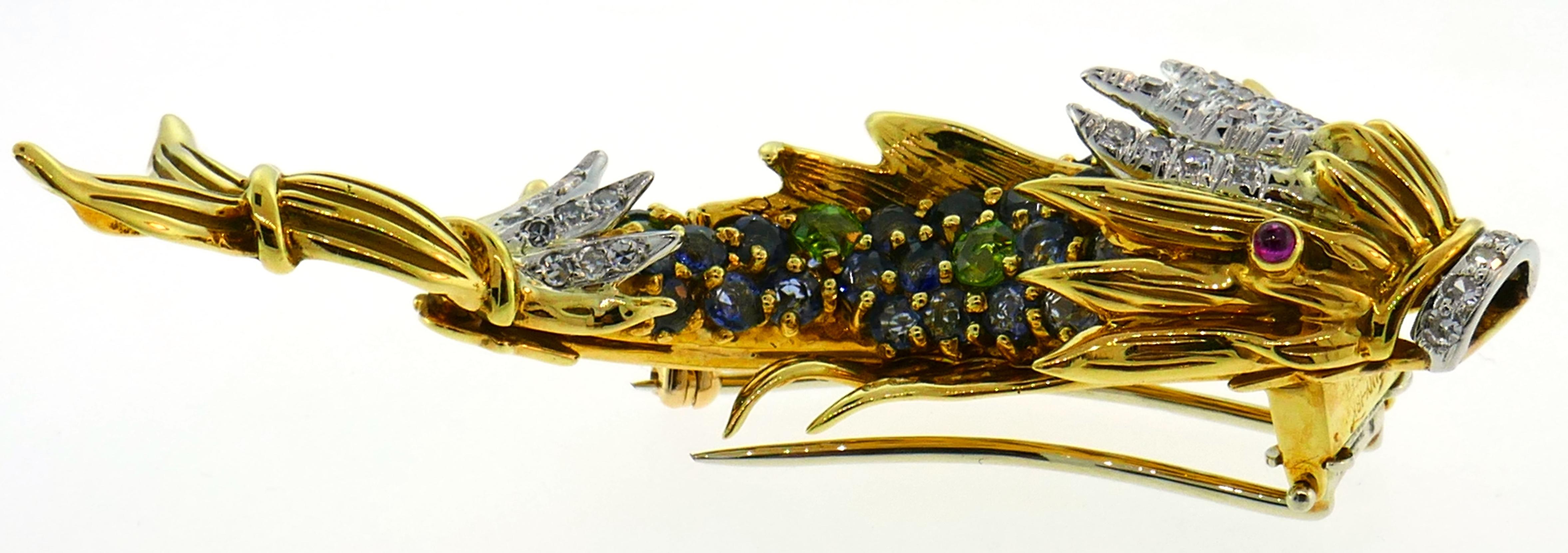 Lovely joyful clip created by Jean Schlumberger for Tiffany & Co. in the 1950s. Designed as a mystical fish, the brooch is definitely a conversational piece. Whimsical, colorful and wearable, the clip is a great addition to your jewelry collection.