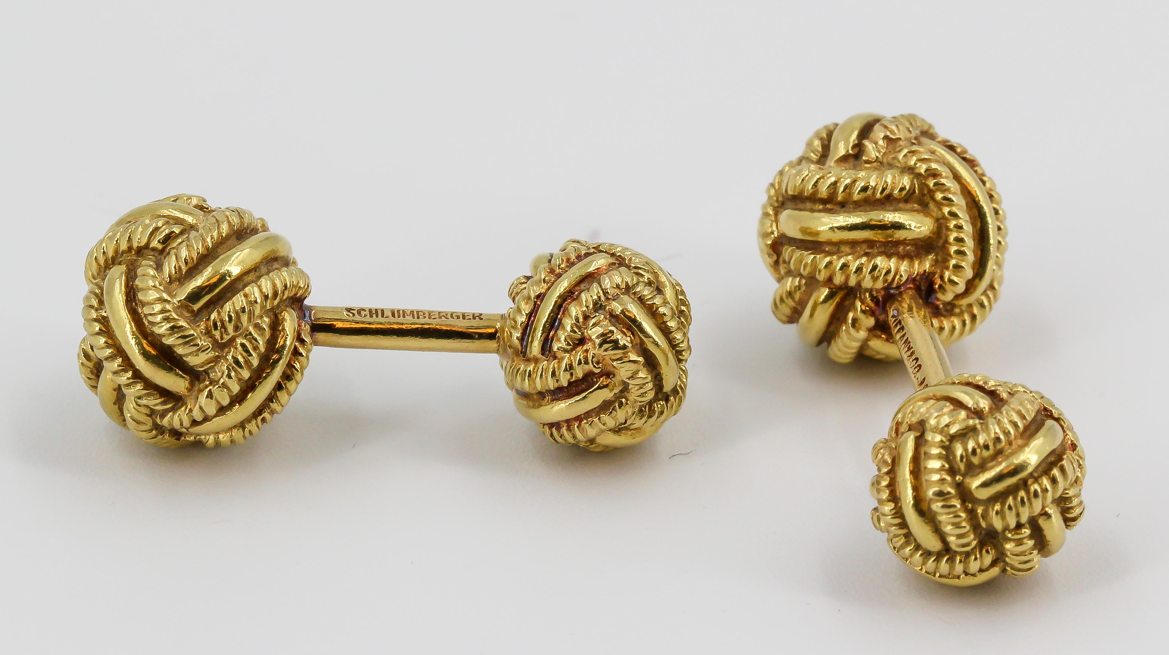 Timeless 18K yellow gold dumbbell cufflinks by Tiffany & Co., Schlumberger, circa 1970s. They feature a twisted rope knot design.

Hallmarks: Tiffany & CO., Schlumberger, 18k