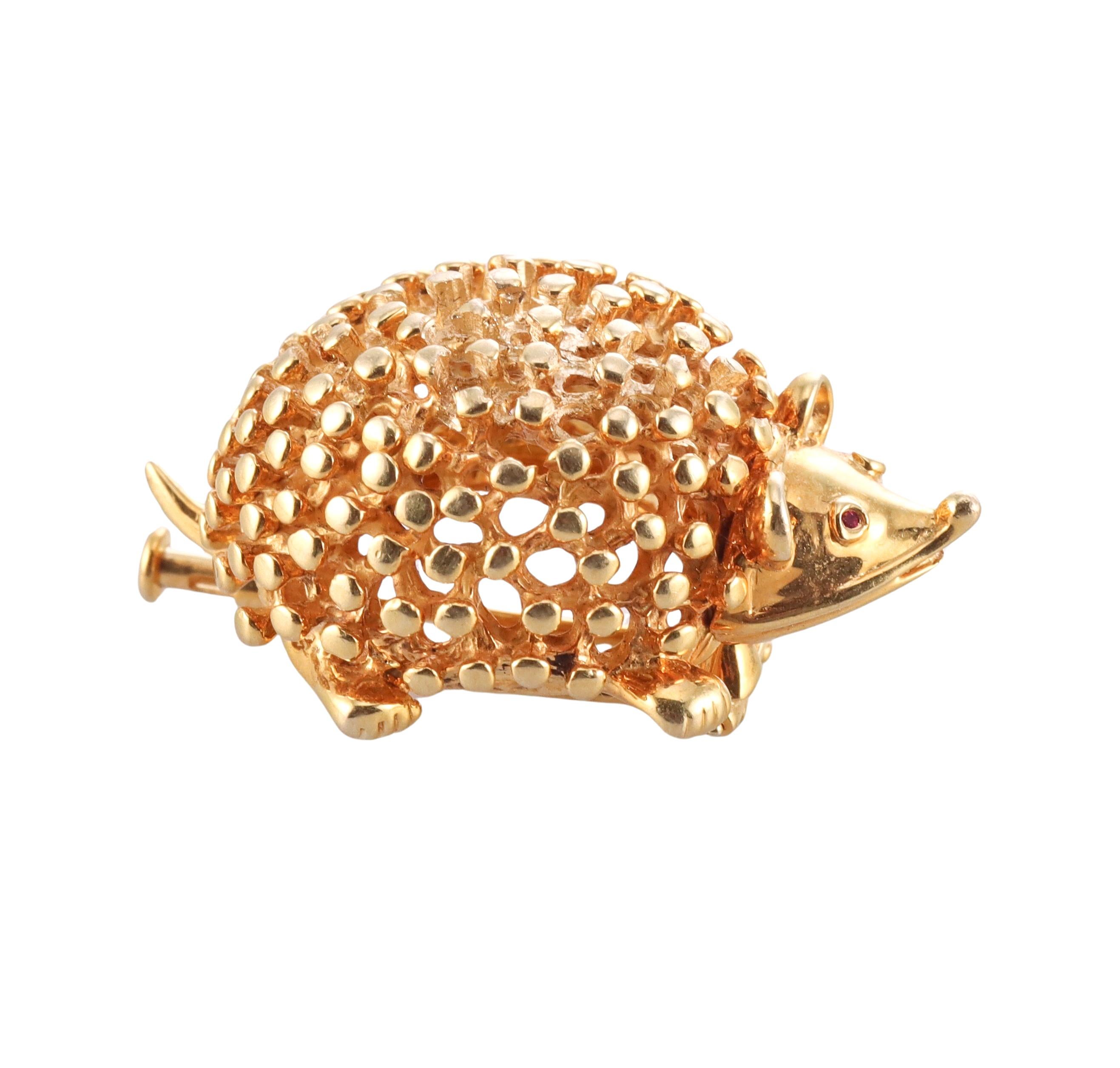 Adorable 18k yellow gold hedgehog brooch , designed by Jean Schlumberger for Tiffany & Co. Set with tiny ruby eyes. The brooch measures 1.25