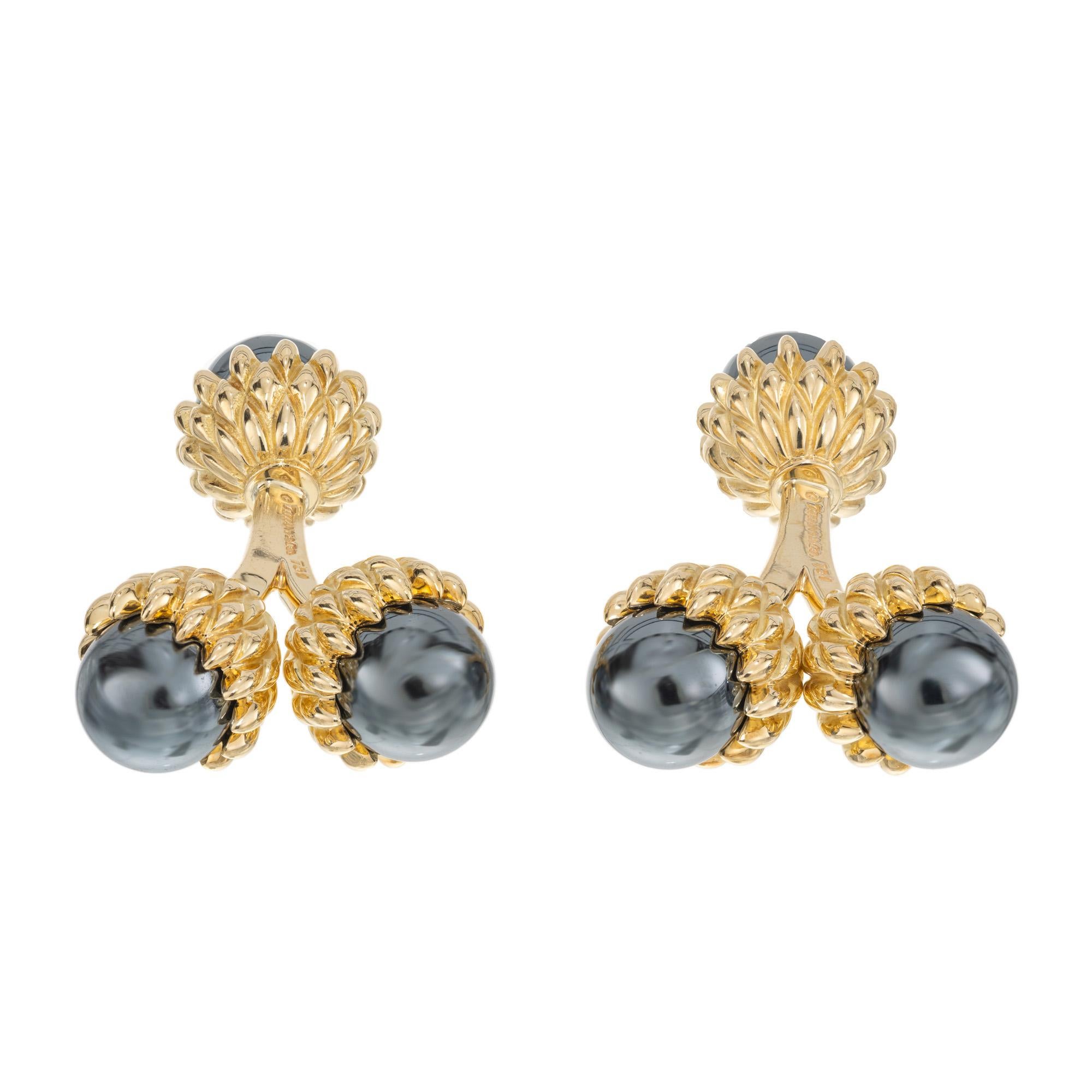Tiffany & Co. Hematite acorn cufflinks. Classic Tiffany style, men's 18k yellow gold hematite double acorn cufflinks created by Jean Schlumberger. Beautiful blue grey cabochon hematite beads, set in highly detailed acorn style crowns. 

6 gray