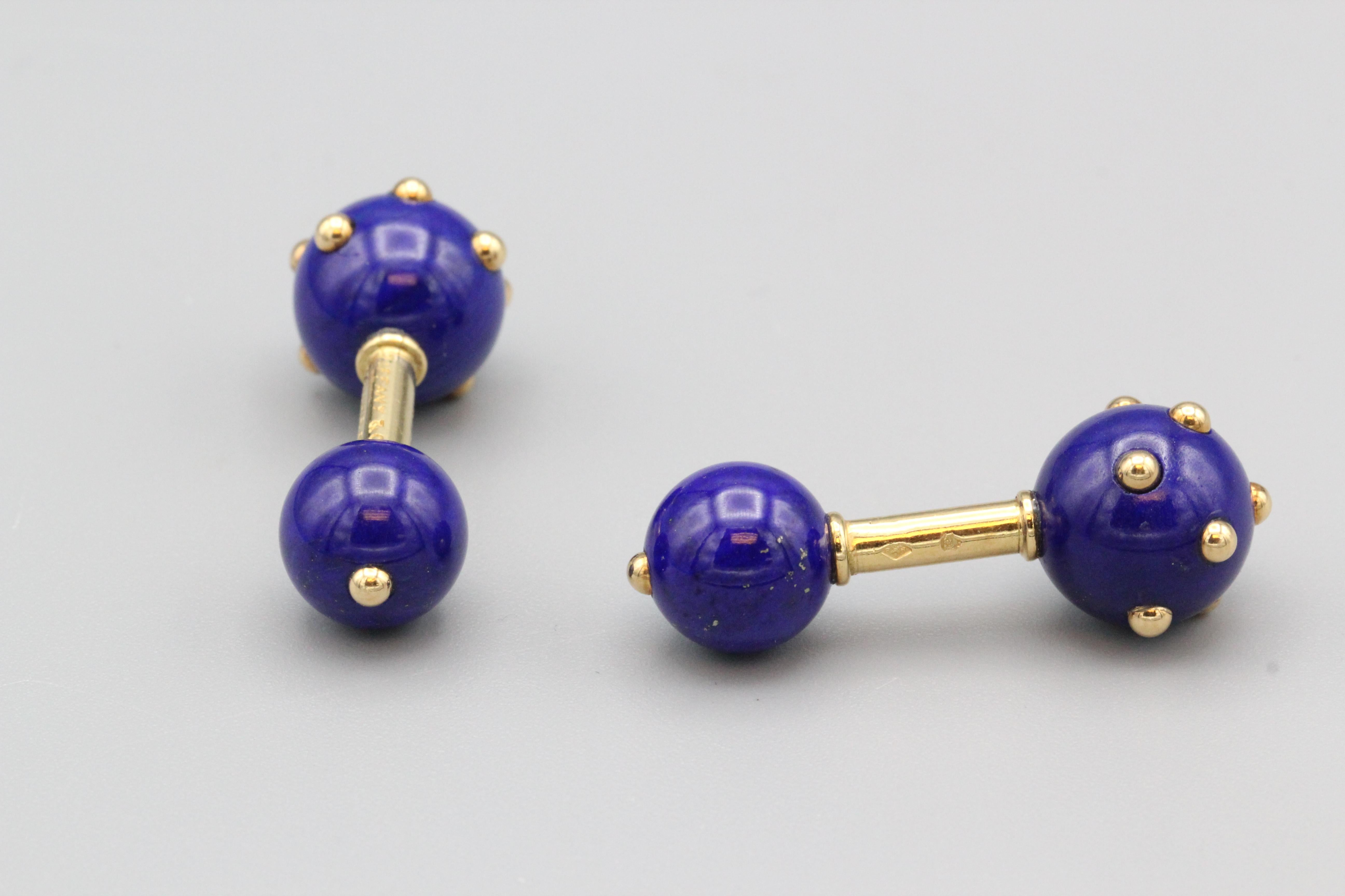 Fine pair of 18K yellow gold and lapis lazuli cufflinks by Tiffany & Co. Schlumberger.  These cufflinks are made of fine polished lapis spheres that are studded with 18k gold beads interspersed on each end.  

Hallmarks: Tiffany & Co. Schlumberger