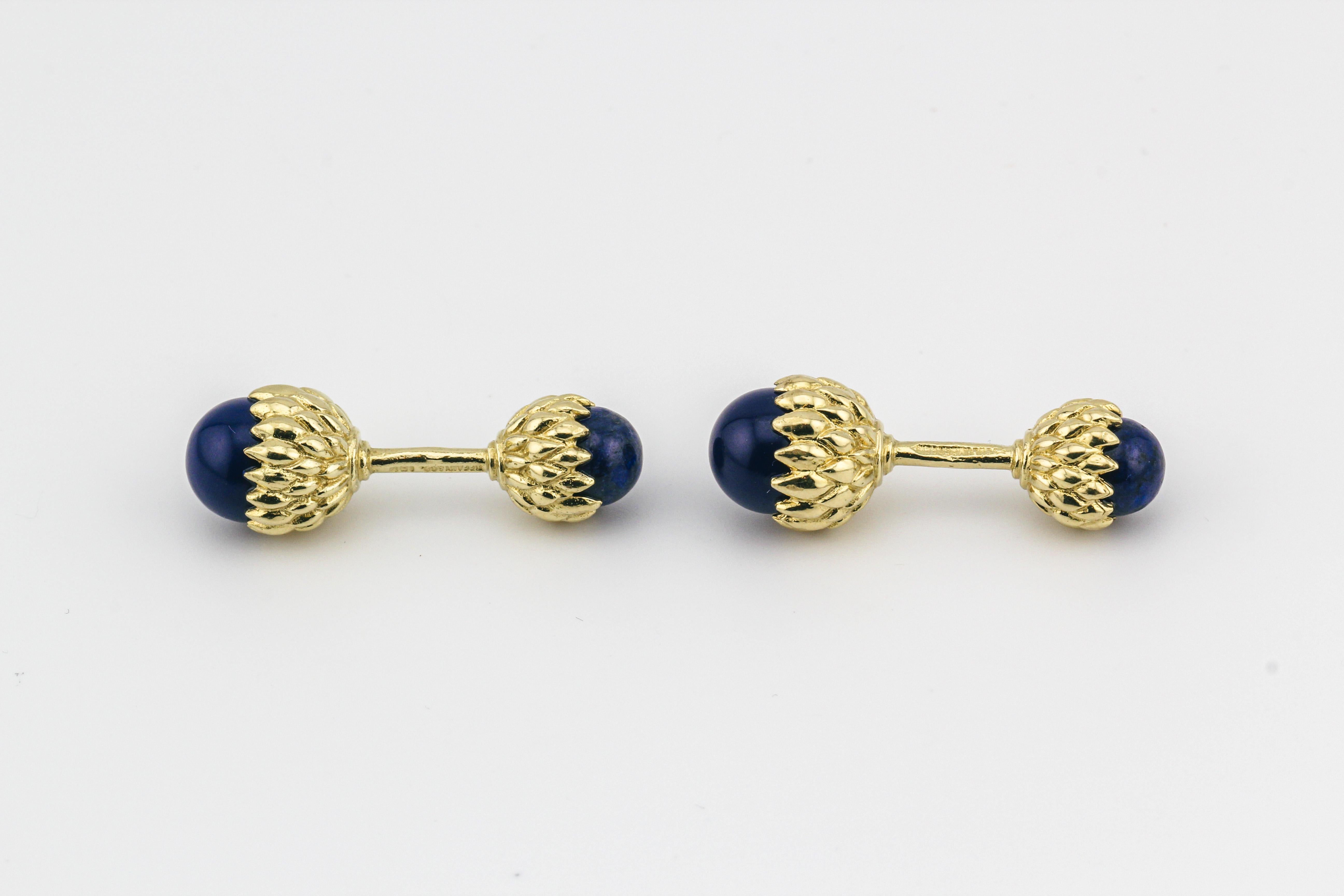 Indulge in the epitome of luxury and distinctive style with the Tiffany & Co. Schlumberger Lapis Lazuli 18K Yellow Gold Acorn Cufflinks. These exquisite cufflinks are a testament to the renowned craftsmanship of Tiffany & Co. and the timeless design