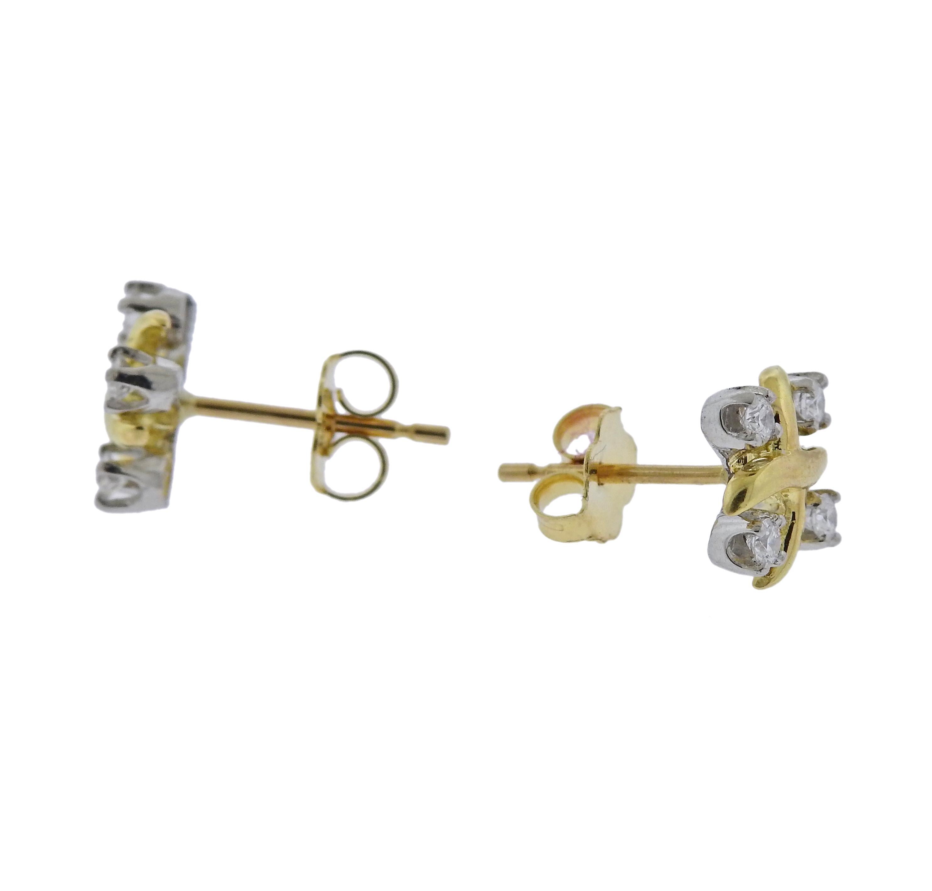 A pair of 18k gold and platinum stud earrings with 0.28ctw in G/VS diamonds, crafted by Jean Schlumberger for Tiffany & Co Lynn collection. Current retail $3000. Earrings are 10.3mm x 10.3mm and weigh 2.9 grams. Marked T & Co, pt950, JS Studios.
