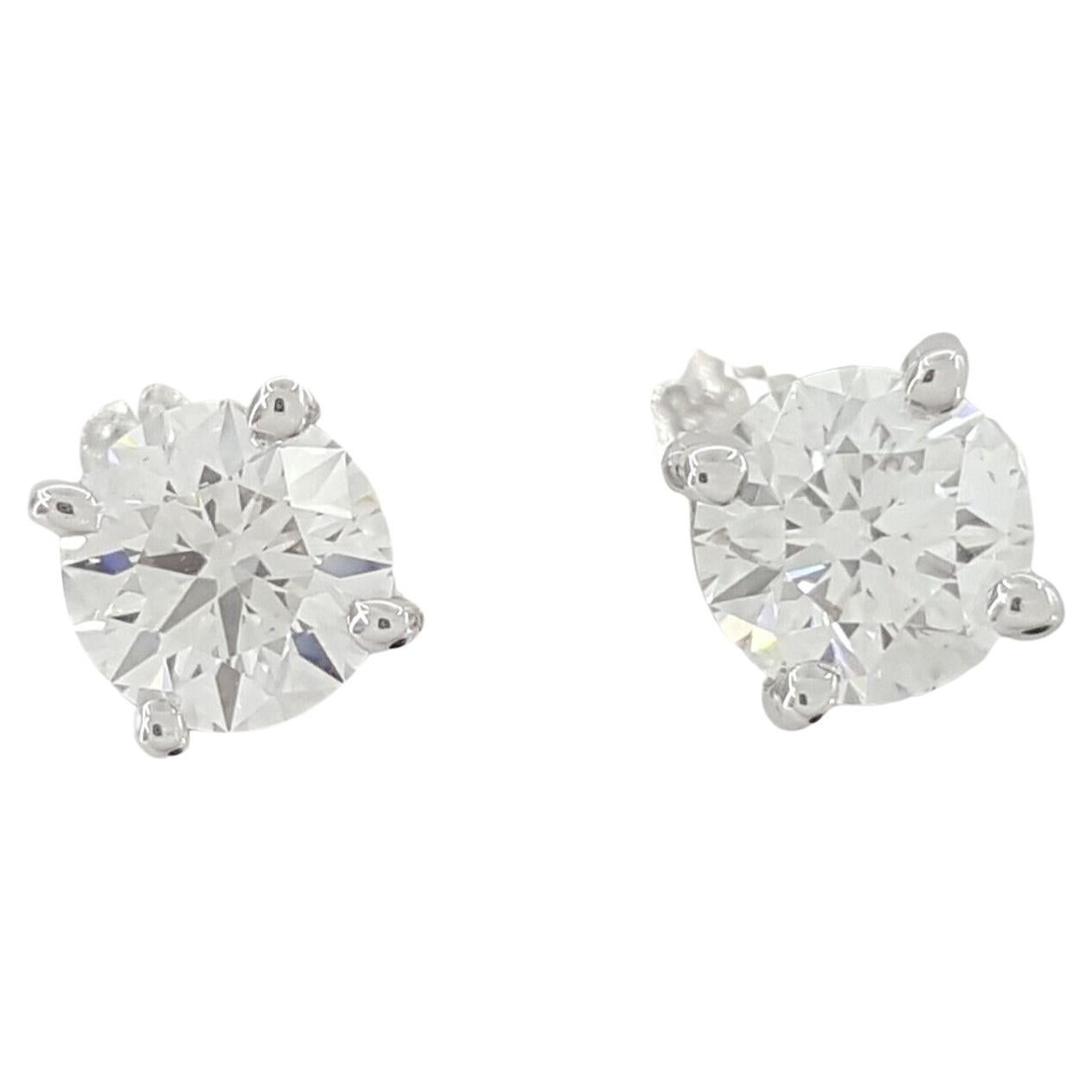 Introducing an exquisite pair of Tiffany & Co. diamond stud earrings, showcasing timeless elegance and exceptional craftsmanship.

Crafted from luxurious platinum, these earrings feature two natural round brilliant cut diamonds, each weighing 0.90