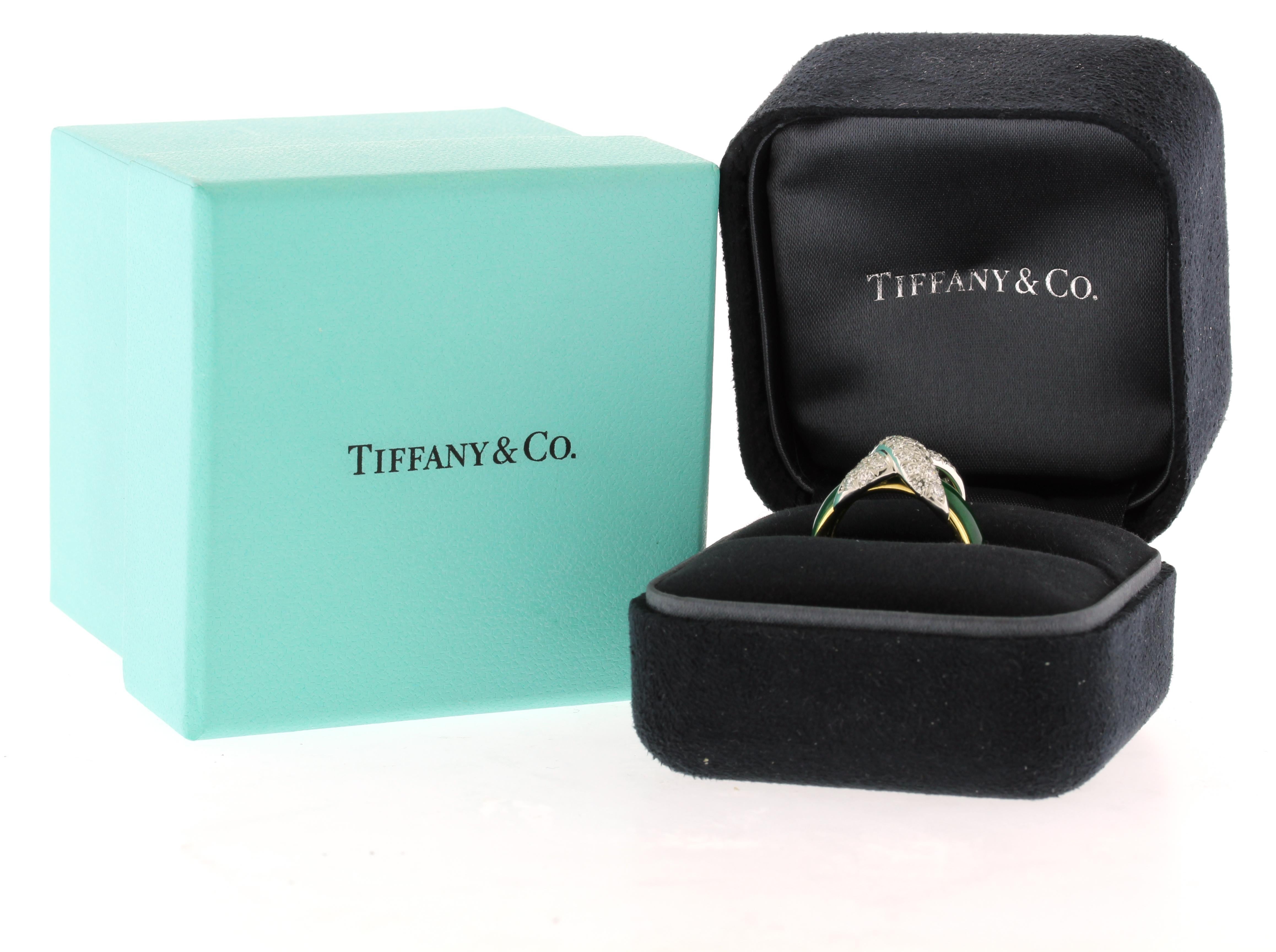 From Jean Schlumberger for Tiffany & Co, the pave X ring has green enamel
♦ Designer: Schlumberger for Tiffany & Co
♦ Metal: 18kt yellow gold and Platinum
♦ Diamond weighs: approximately  .85cts
♦ Size: 7 1/4
♦ Packaging: Tiffany Box
♦ Condition: