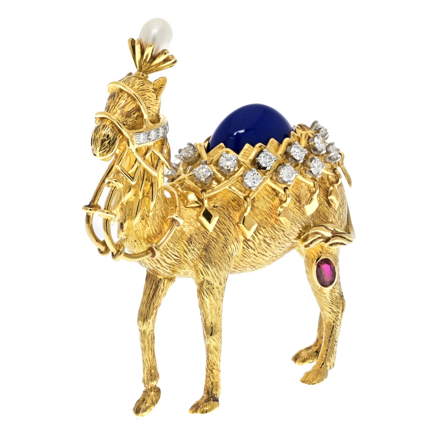 The vintage camel brooch designed by Jean Schlumberger for Tiffany & Co. is a masterpiece of exquisite craftsmanship and lavish decor. The brooch is a stunning depiction of a camel, made from luxurious 18K yellow gold and adorned with ruby, pearl,