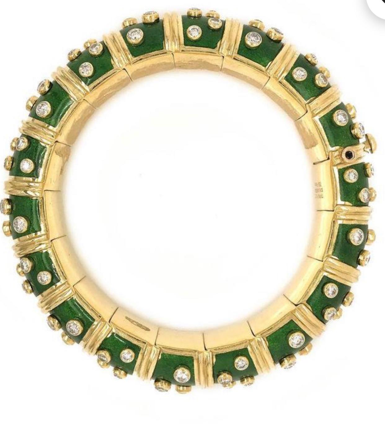A DIAMOND AND GREEN ENAMEL BANGLE BRACELET, BY JEAN SCHLUMBERGER, TIFFANY & CO.
Designed as a Green paillonné enamel hinged bangle, decorated with collet-set diamonds and sculpted gold vertical bands, 6 3/4 ins. inner diameter, mounted in platinum