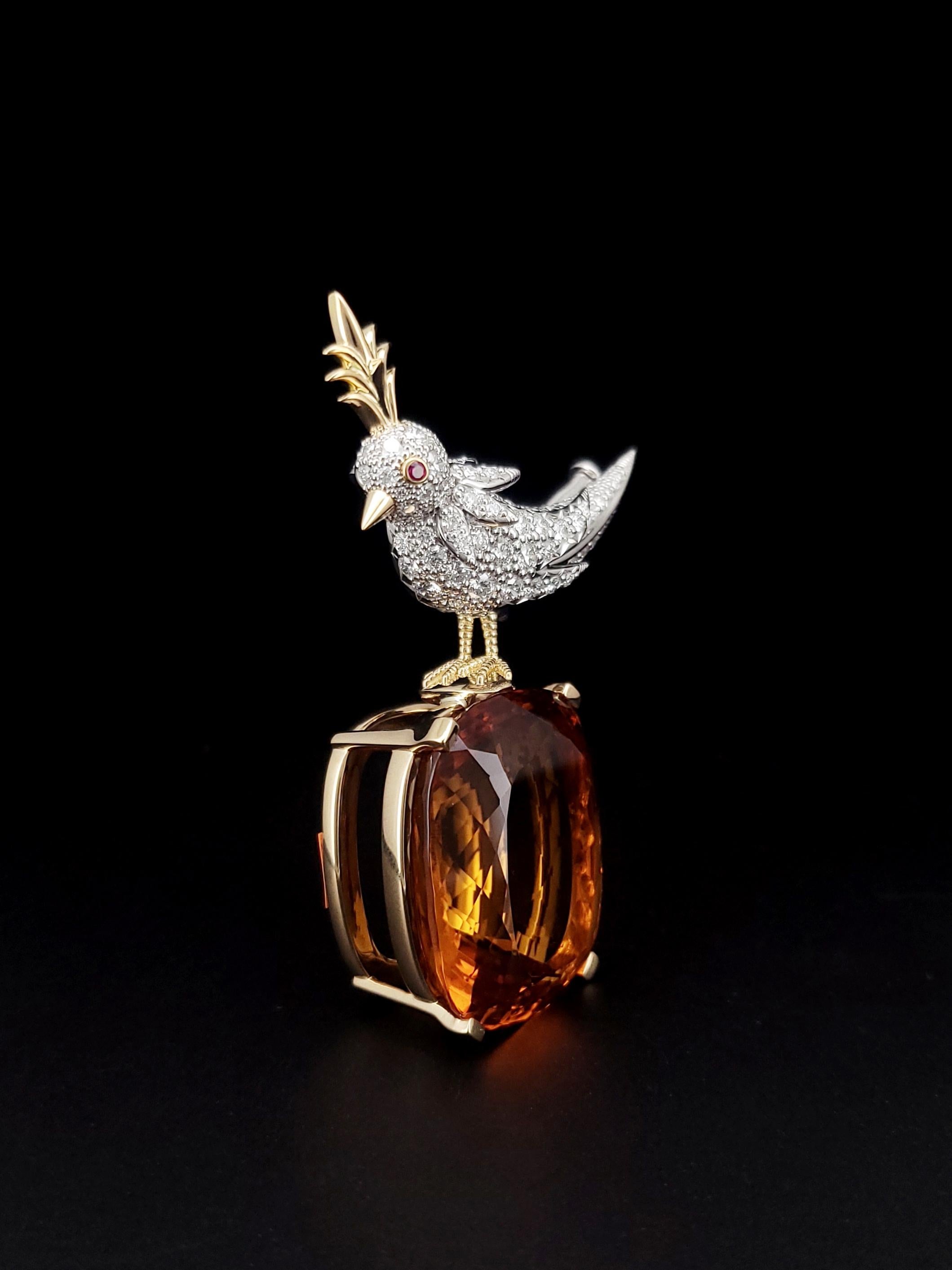 Exceptional rare item. Iconic Bird on a Rock by Tiffany and Co in Large size in Mint Condition. 
Crafted in solid 18K yellow gold & platinum for the bird's body.  The eye has a genuine pink sapphire, 0.01 carat, round cut & bezel set. The body of