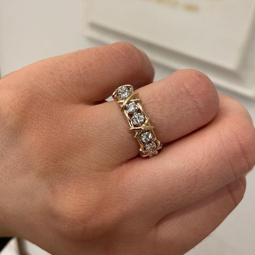 Tiffany & Co. Schlumberger ® 1.16 ct Total Weight Platinum & 18K Yellow Gold Round Brilliant Cut Diamond Sixteen Stone Eternity Ring. 

The ring weighs 9.1 grams, size 6.5, there are 16 Natural Round Brilliant Cut diamonds weighing 1.16 ct, F-G in