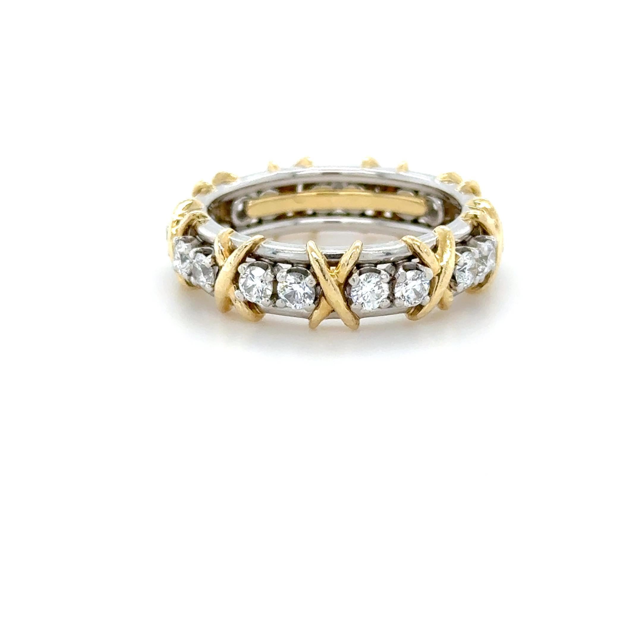 This beautifully classic ring designed by Schlumberger for Tiffany & Co. in their X collection, contains 16 round brilliant cut diamonds weighing approximately 1.20 carats total. Perfect for your ring stack!

Accompanied by a Tiffany & Co. ring