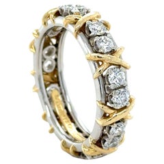Tiffany & Co., Schlumberger, Platinum and Yellow Gold 16 Stone Diamond X Band