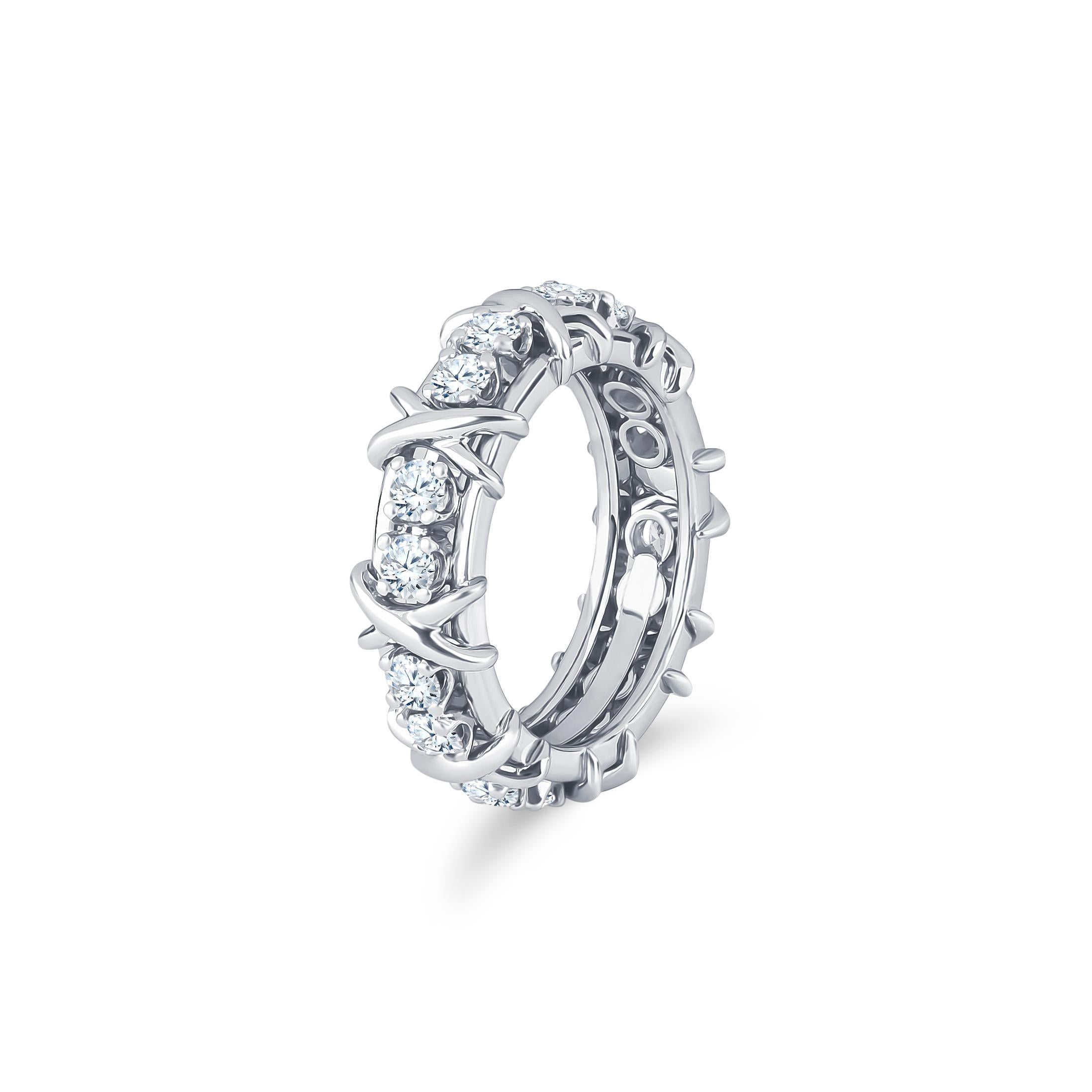 Tiffany & Co Schlumberger platinum band with 16 round diamonds all around, approximately 1.33 carat total weight. Ring size 6.