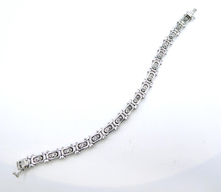 Tiffany and Co. Schlumberger Platinum Diamond 36 Stone X Tennis Bracelet at  1stDibs