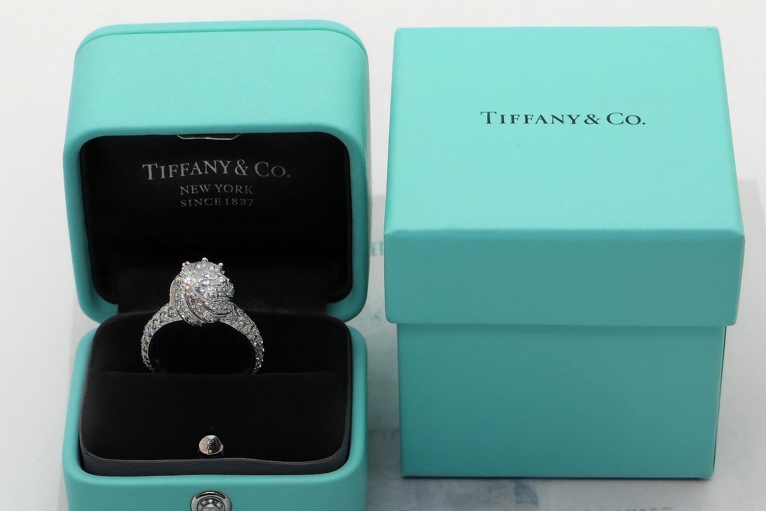 Tiffany & Co. Schlumberger Platinum Diamond Engagement Ring

A stunning creation from Tiffany & Co.’s Schlumberger collection.
The center round brilliant diamond weighs 1.71 carats, graded G color, VS2 clarity.
Accented by 98 round brilliant side