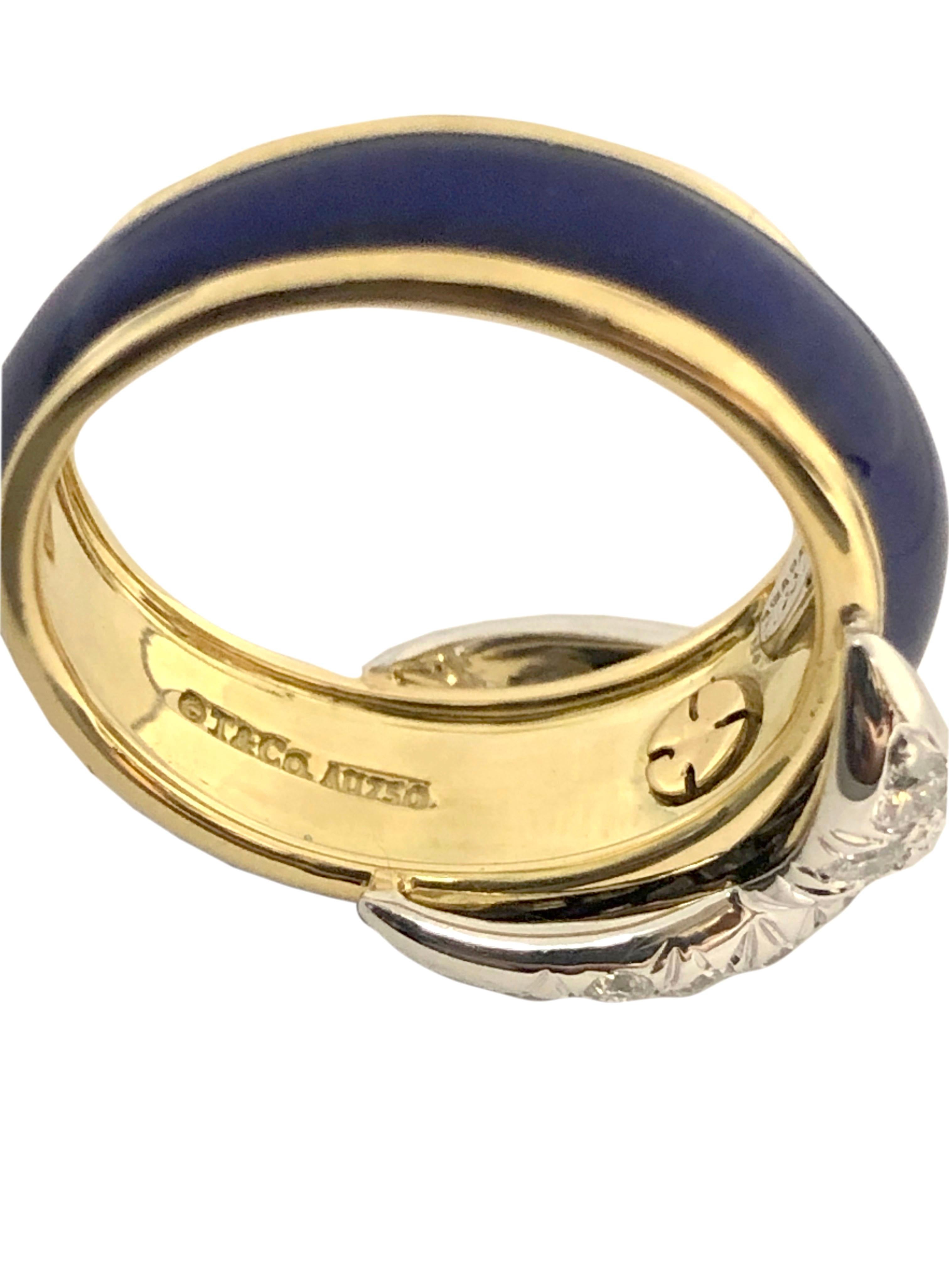 Circa 2000 Jean Schlumberger for Tiffany & Company 18K Yellow Gold and Platinum X Ring, the top of the ring measures 5/8 inch across and is set with Round Brilliant cut Diamonds totaling .85 Carat. Further finished in Cobalt Blue Enamel. Finger size