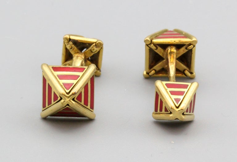 Fine pair of red enamel and 18K yellow gold cufflinks by Tiffany & Co. Schlumberger, circa 1970s.  The cufflinks have a pyramidal shape at each end, one side slightly larger than the other. A rare find!

Hallmarks: Tiffany & Co. Schlumberger, 18k.