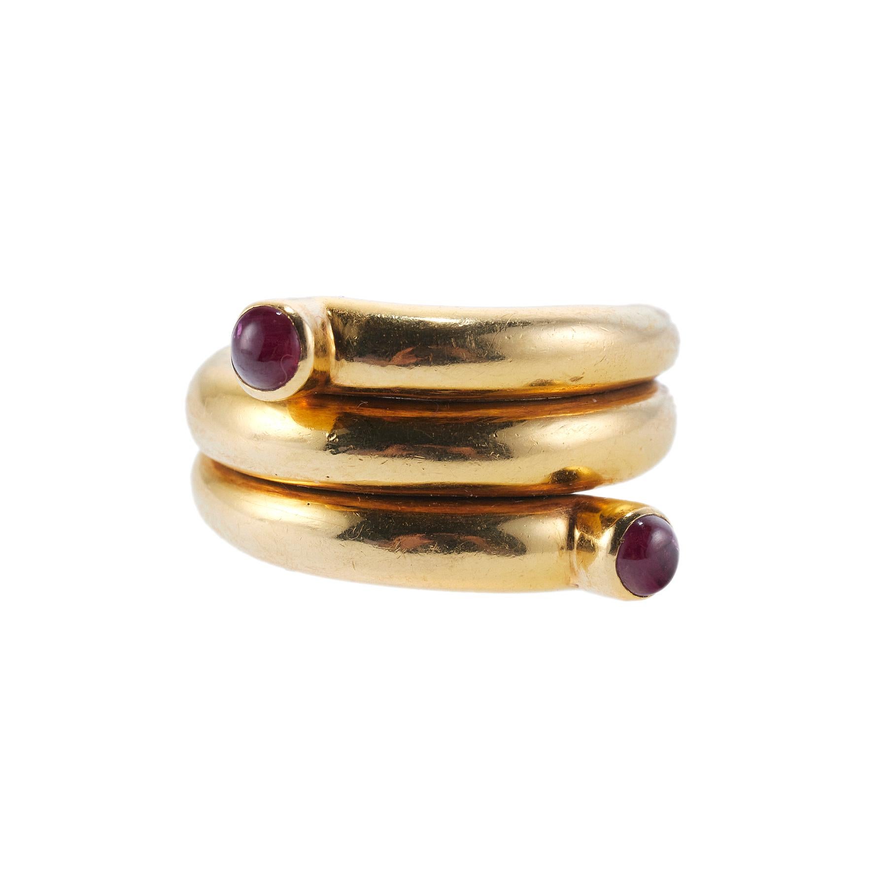 18k gold wrap ring by Jean Schlumberger for Tiffany & Co, with two rubies. Ring size 6 and it measures 13mm wide. Marked: Tiffany & Co, Schlumberger, 18k. Weight is 26.2 grams.