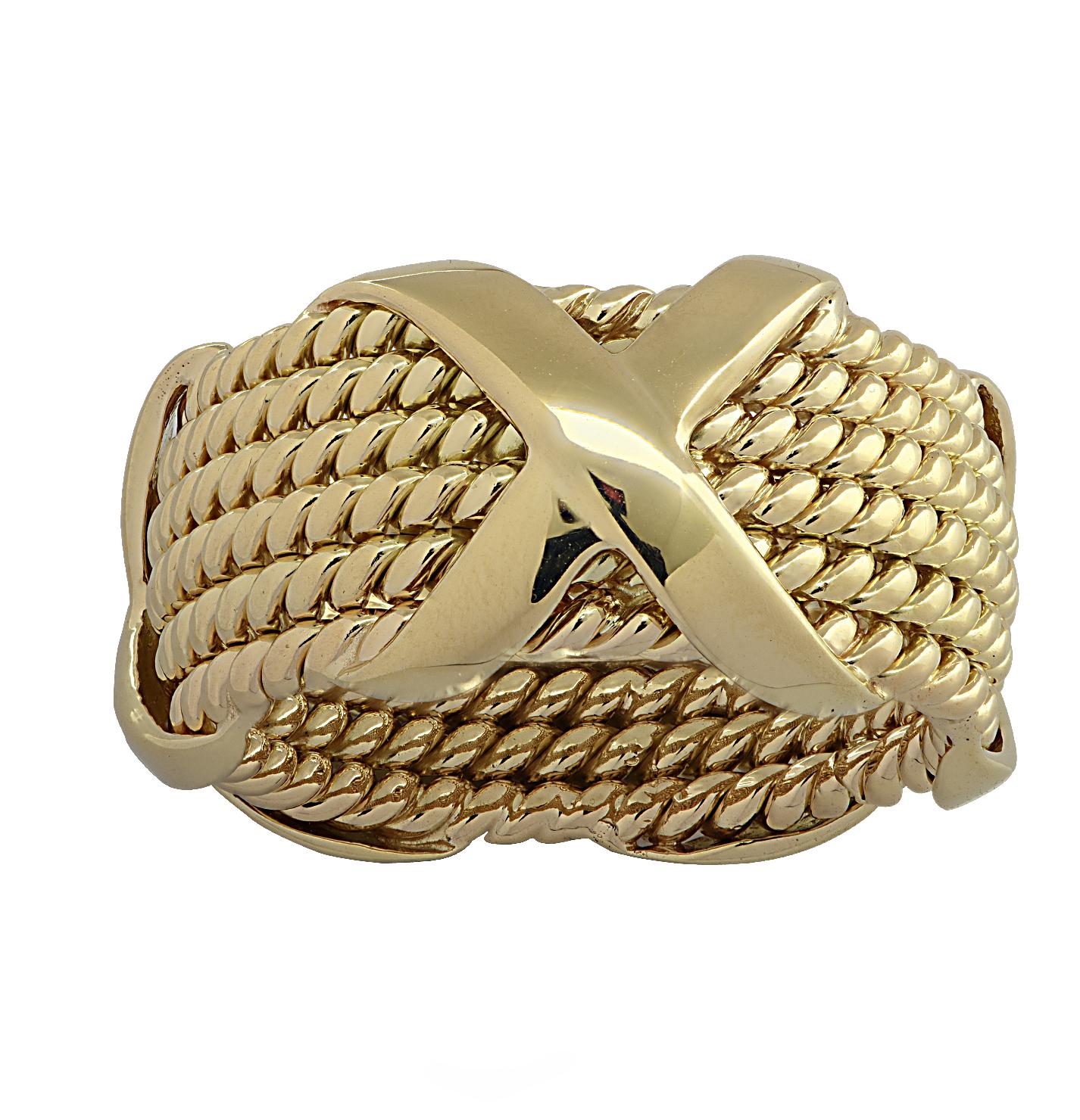 Stunning Tiffany & Co. Schlumberger Rope Six-row X Ring expertly crafted in 18k Yellow Gold, featuring six twisted rope bands adorned with three highly polished “X’s”. This iconic ring measures 11.12 mm in width and it is a size 6.5. Since 1956 Jean