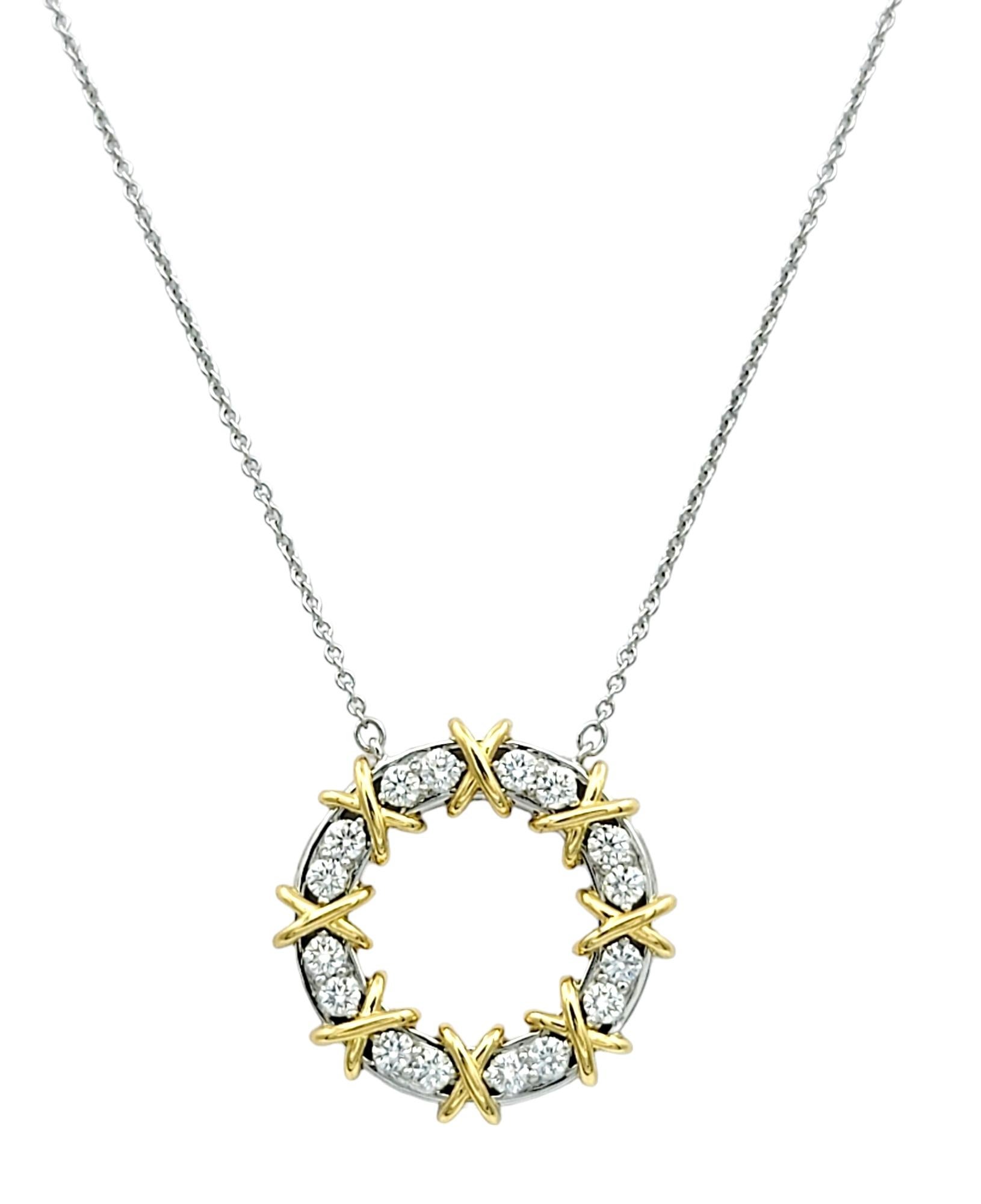 Adorn yourself with the timeless sophistication of this iconic Tiffany & Co. 'Sixteen Stone 'Schlumberger necklace, a stunning fusion of classic design and luxurious materials. The pendant, a captivating open circle, is a masterpiece of