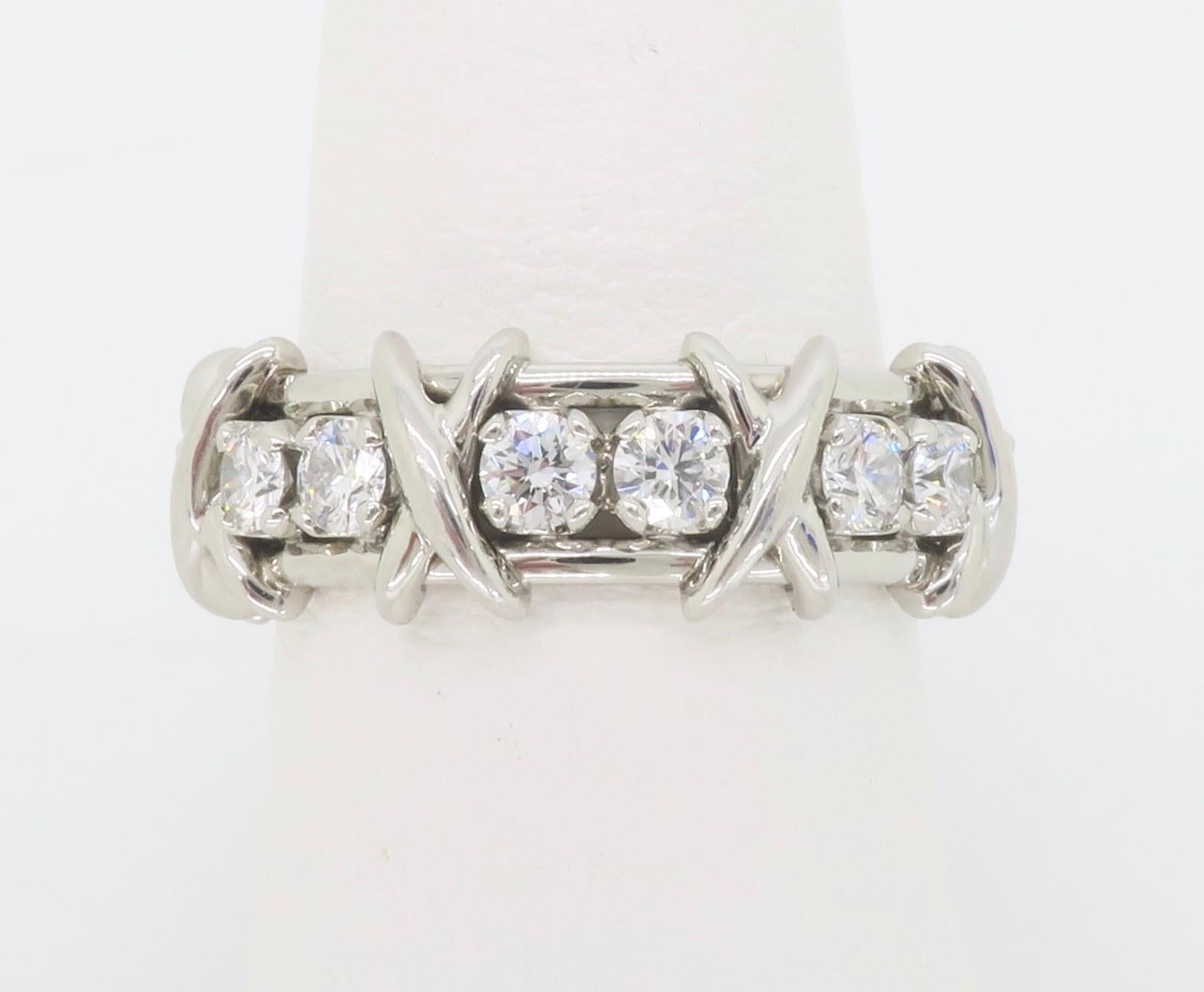 Never worn iconic Tiffany & Co. Schlumberger sixteen diamond eternity band made in Platinum, size 5.5, that comes with original bag, box, and white ribbon, as shown in images. 

Description directly from Tiffany & Co. as follows, 

Jean