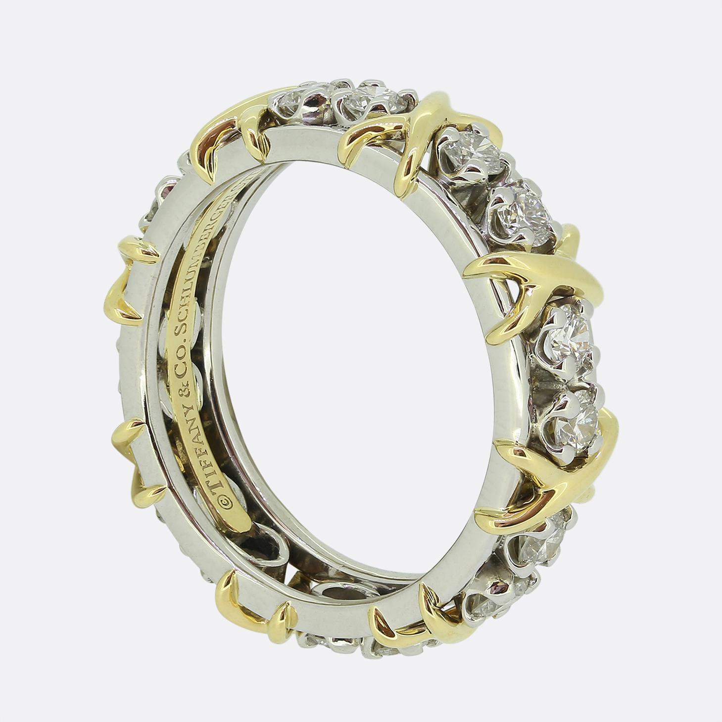 Here we have an sixteen-stone diamond eternity ring by Jean Schlumberger for Tiffany & Co. This iconic piece boasts a sophisticated elegance with a contemporary yet classic design. Dazzling round brilliant cut diamonds circulate the entirety of the