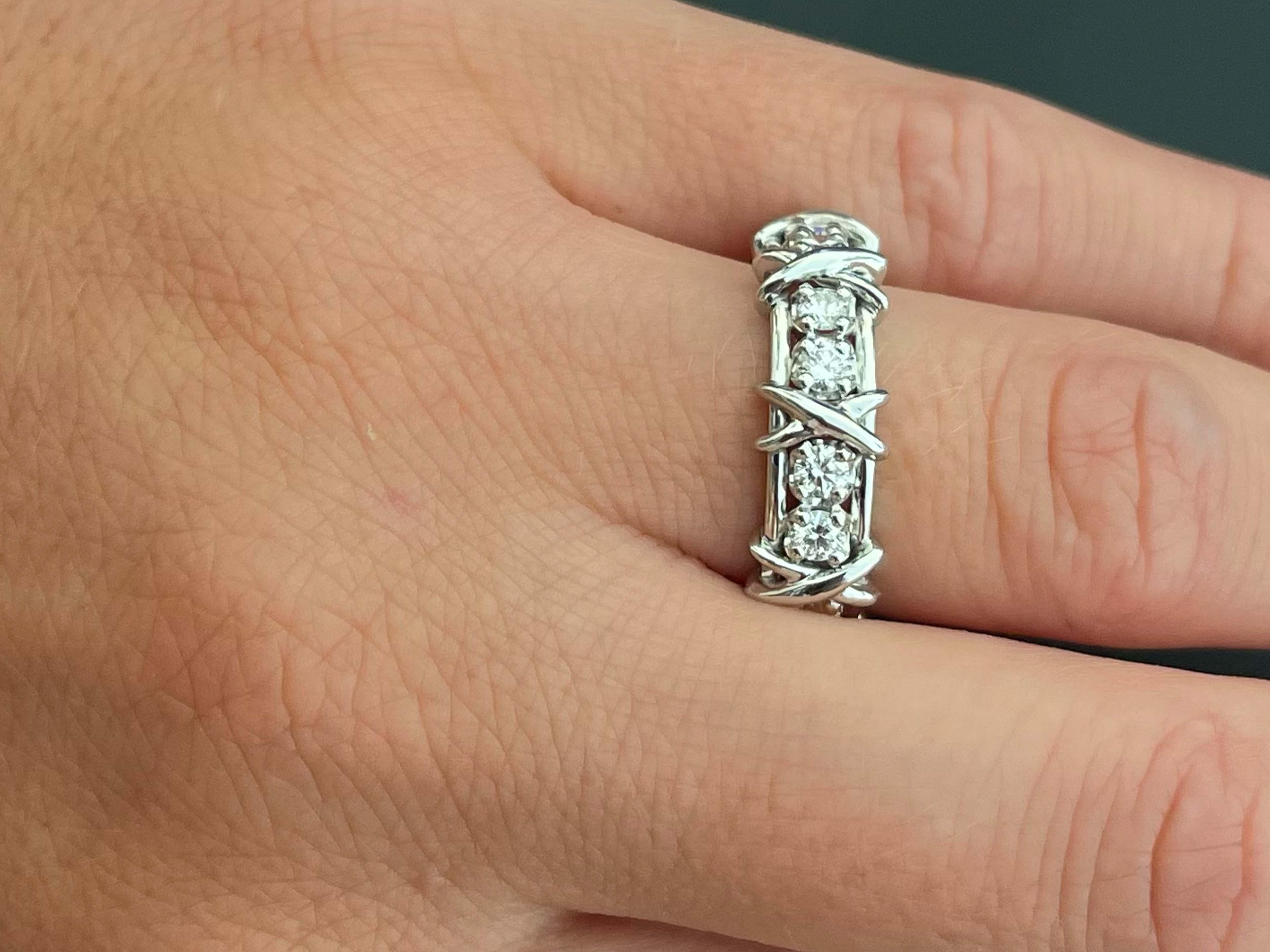 Authentic Tiffany & Co. Schlumberger Sixteen Stone Platinum Ring. Jean Schlumberger’s visionary creations are among the world’s most intricate designs. Brilliant diamonds alternate with platinum X's to create this dazzling design. The 16 round