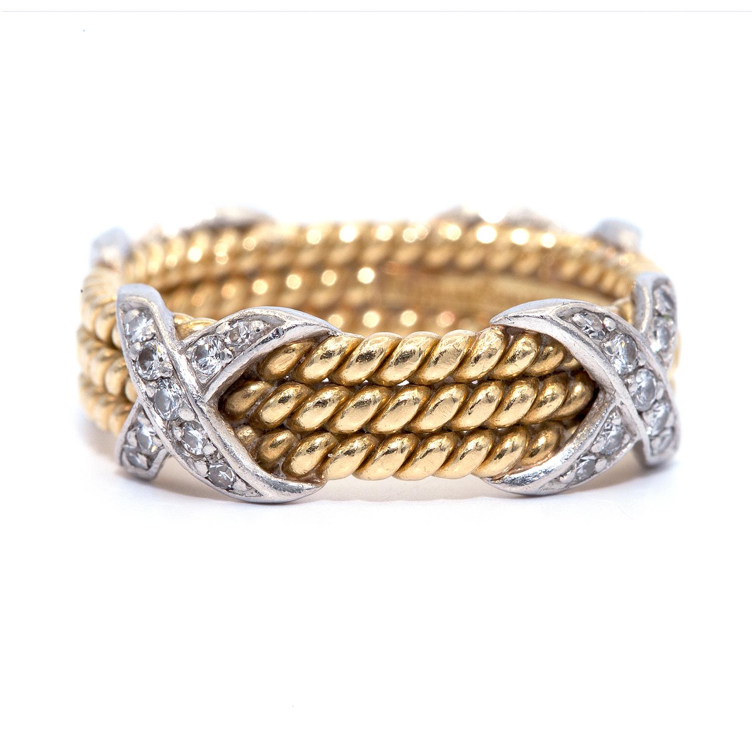 1960's Tiffany & Co. Schlumberger band.
Jean Schlumberger’s visionary creations are among the world’s most intricate designs. Brilliant diamonds illuminate this striking ring.
Designed with three rows of 18 karat yellow gold twisted rope patterned.
