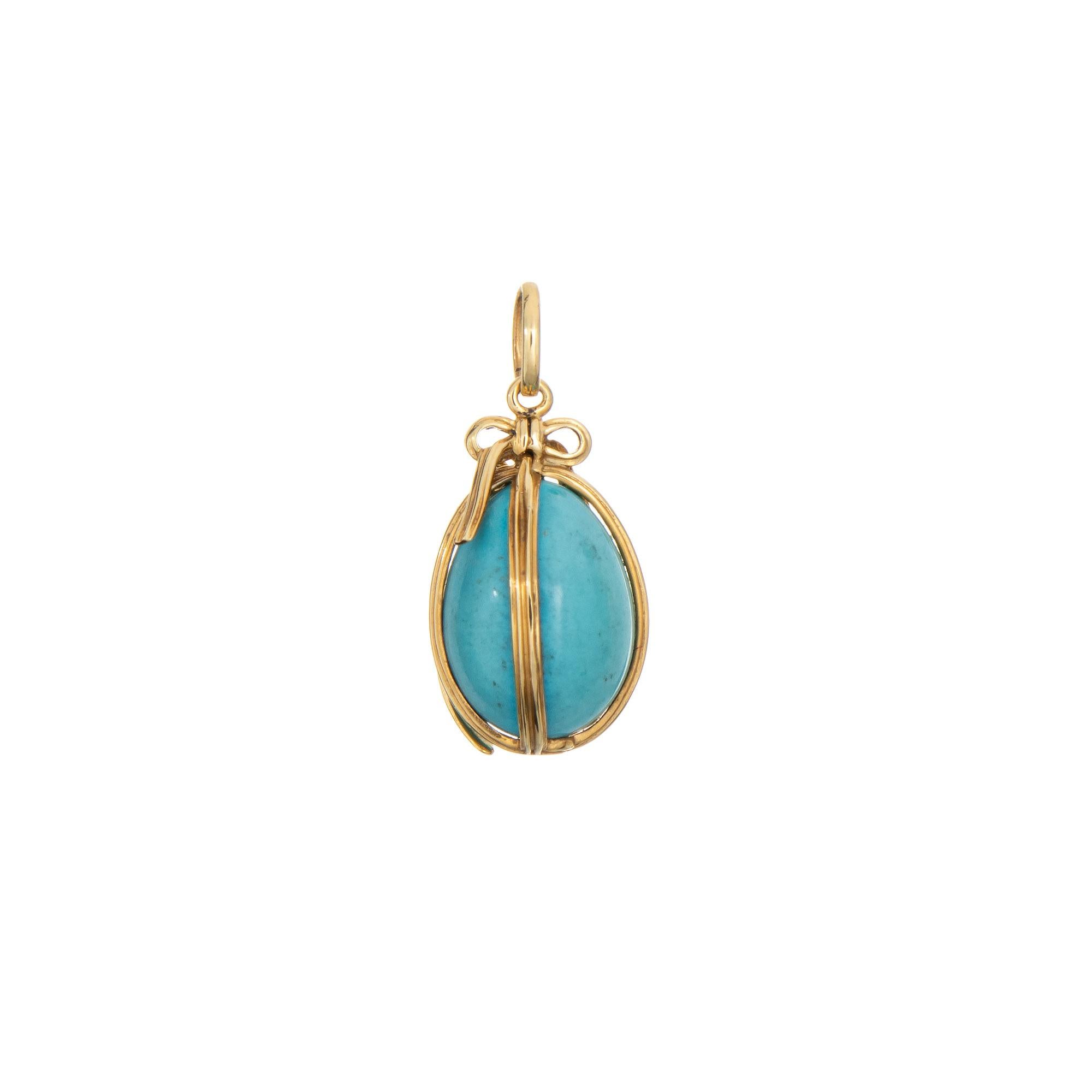 Finely detailed vintage Tiffany & Co Schlumberger turquoise egg charm crafted in 18k yellow gold (circa 1980s). 

Turquoise measuring 16mm x 10.5mm is in very good condition and free of cracks or chips. 

The egg is designed by Jean Schlumberger for