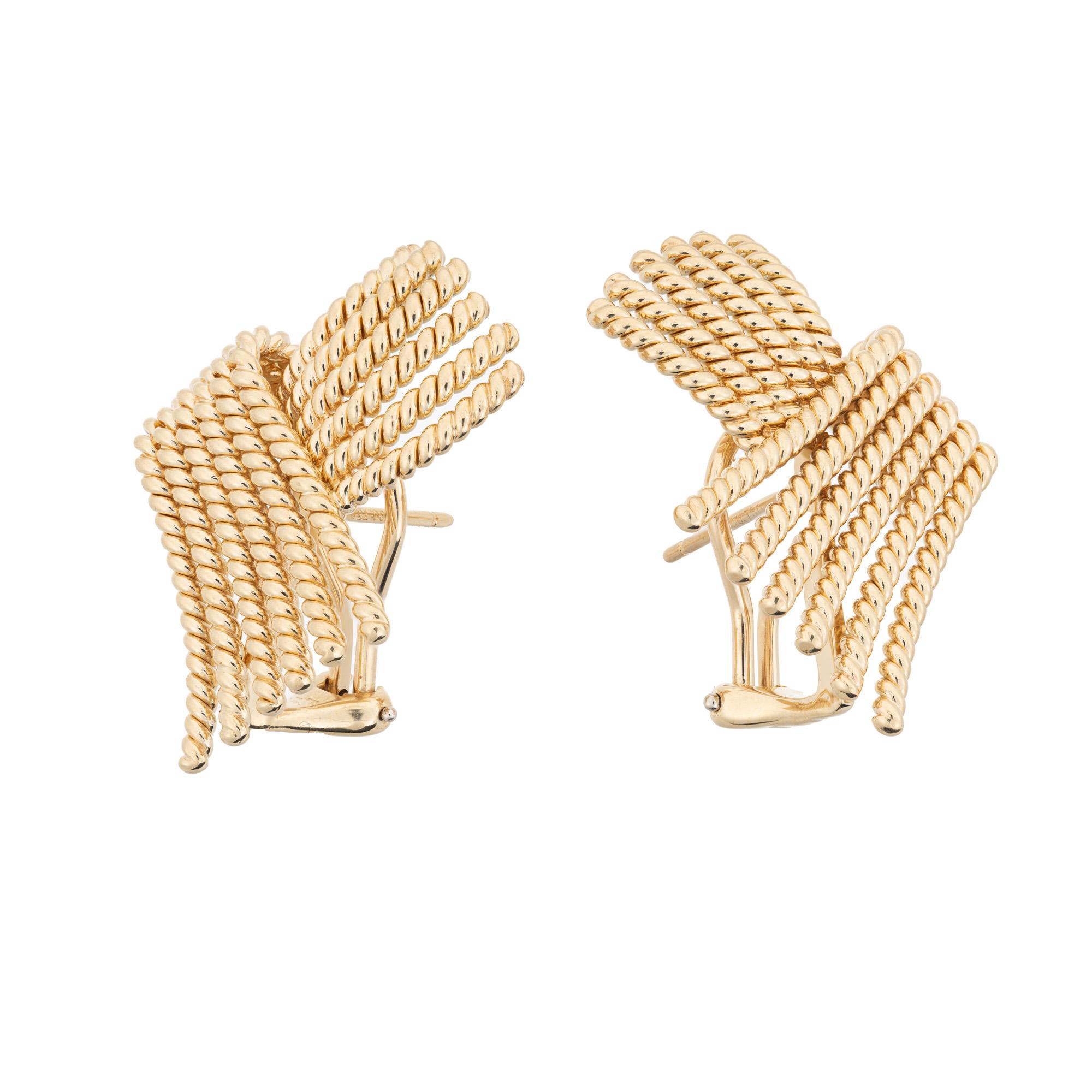 Tiffany & Co. 18k yellow gold clip post earrings. Designed for Tiffany by Jean Schlumberger, each earring has 12 strands of twisted rope wire motif. The backings are clip post lever style. They date back to the early 1980's. 
Jean Michel