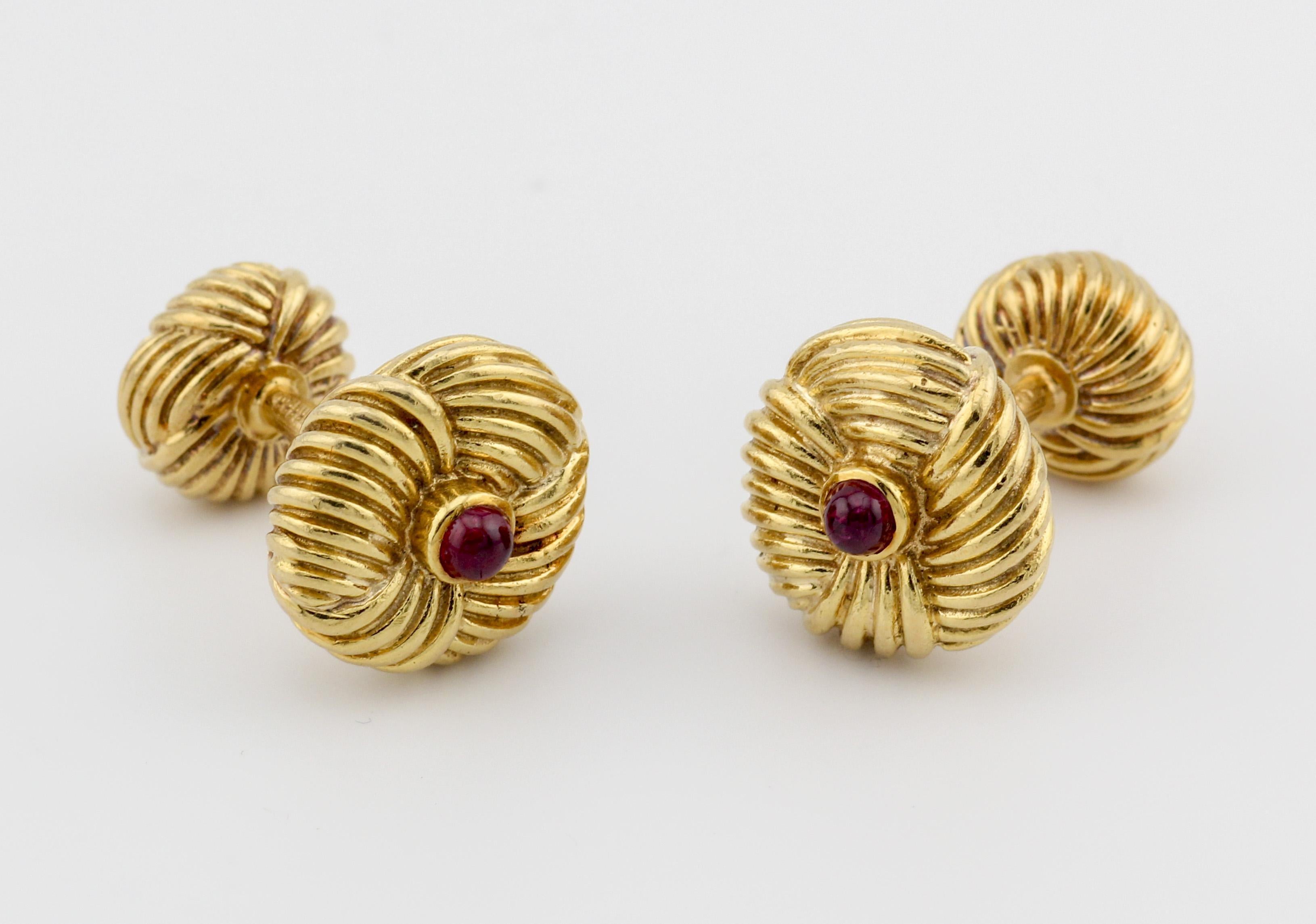 Step back in time to the glamorous 1970s with the Tiffany & Co. Schlumberger Vintage Ruby 18k Yellow Gold Cufflinks, a true embodiment of opulence and enduring style. Crafted by the legendary designer Jean Schlumberger for Tiffany & Co., these