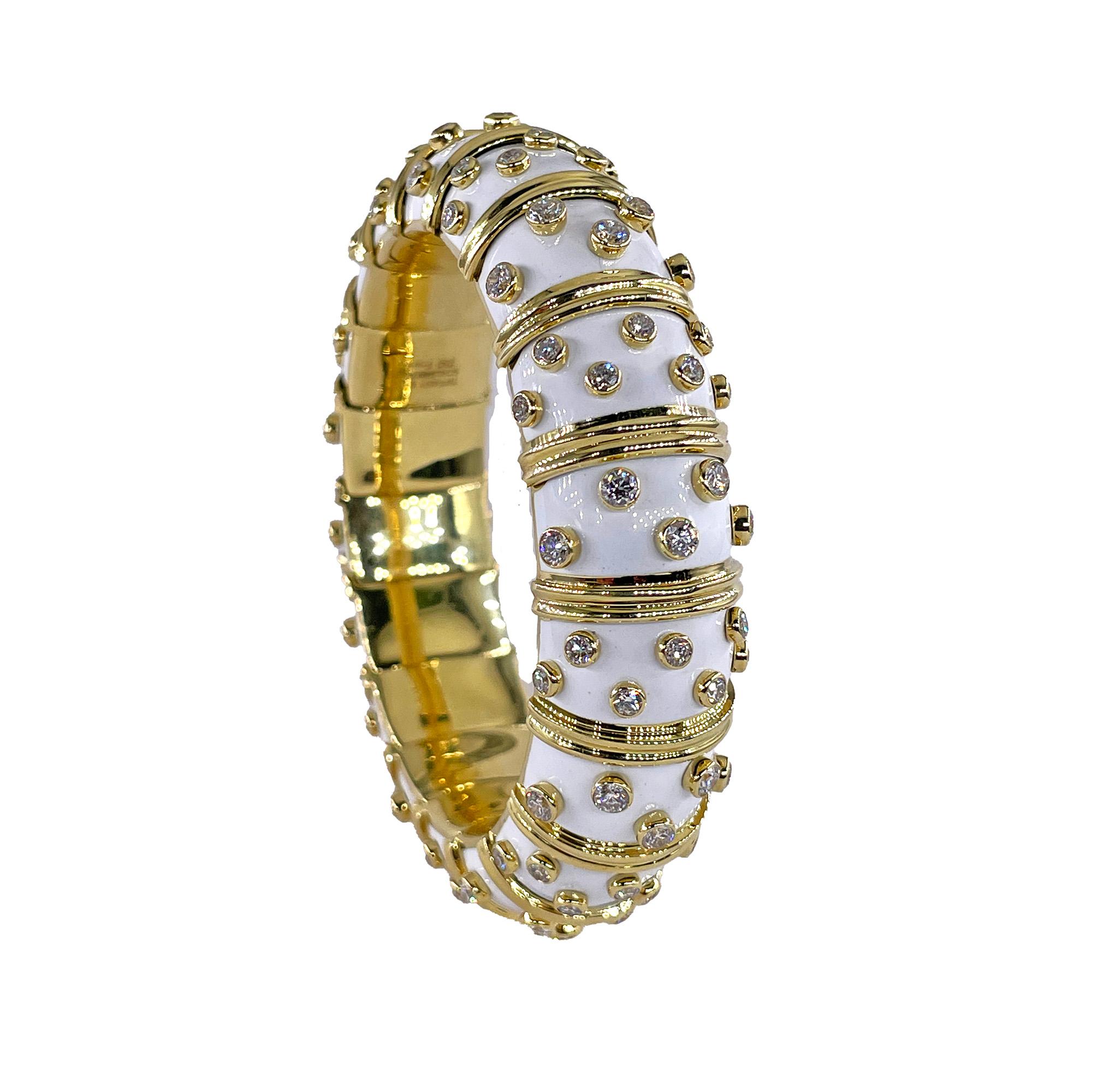 DIAMOND DOTS WHITE ENAMEL 18K GOLD BANGLE BRACELET, BY JEAN SCHLUMBERGER, TIFFANY & CO. PARIS
A masterpiece of modern luxury, this Iconic Tiffany & Co. Schlumberger bracelet seamlessly blends classic elegance with contemporary flair. 
Designed as a