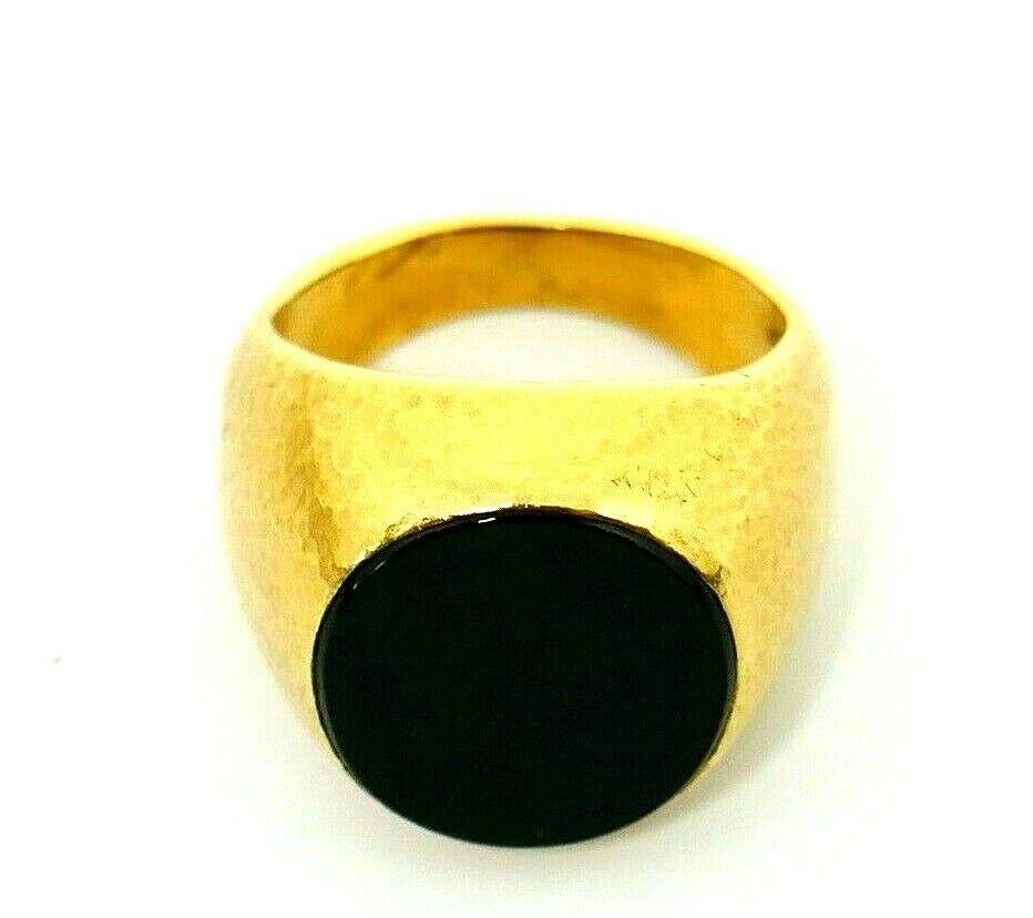 Vintage (circa 1970s) 18k yellow hammered gold onyx signet ring by Jean Schlumberger for Tiffany & Co.
Timeless minimalist chick from the iconic Tiffany's designer. 
The stone is 0.75