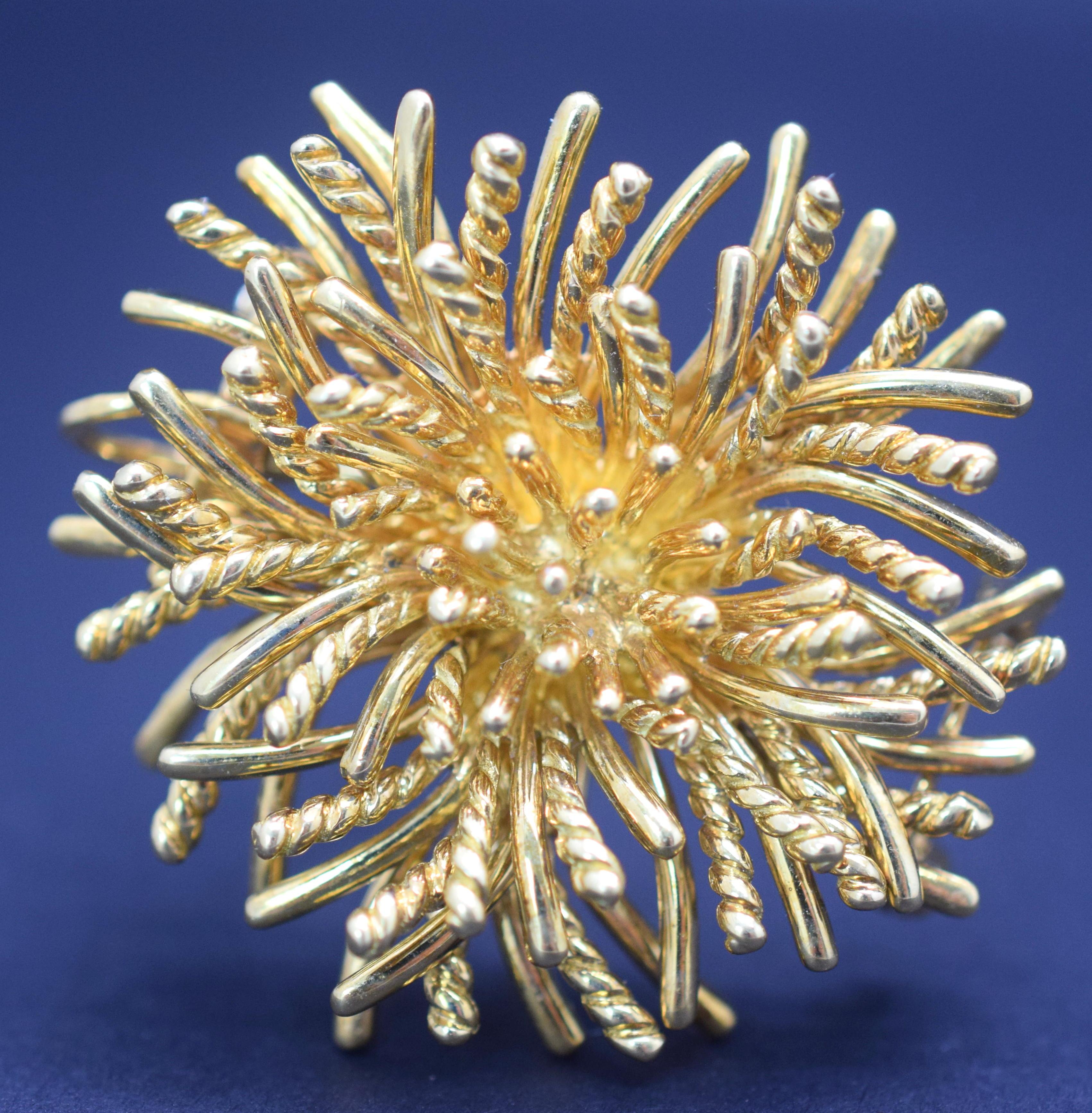 Tiffany & Co sea anemone brooch crafted in 18k yellow gold. The sea anemone pin was created in the 1970’s. The diameter of the broach is 1 ½