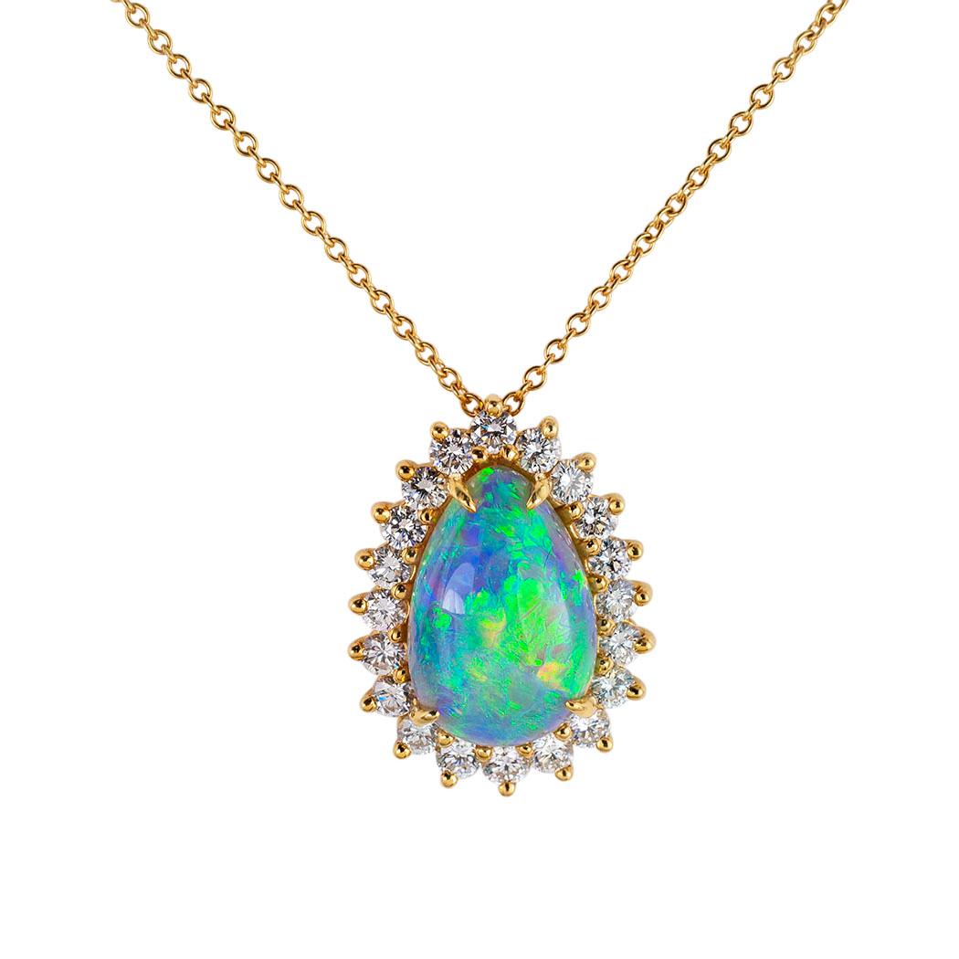 Tiffany & Co semi-black boulder opal diamond and yellow gold pendant circa 1980.  Clear and concise information you want to know is listed below.  Contact us right away if you have additional questions.  We are here to connect you with beautiful and