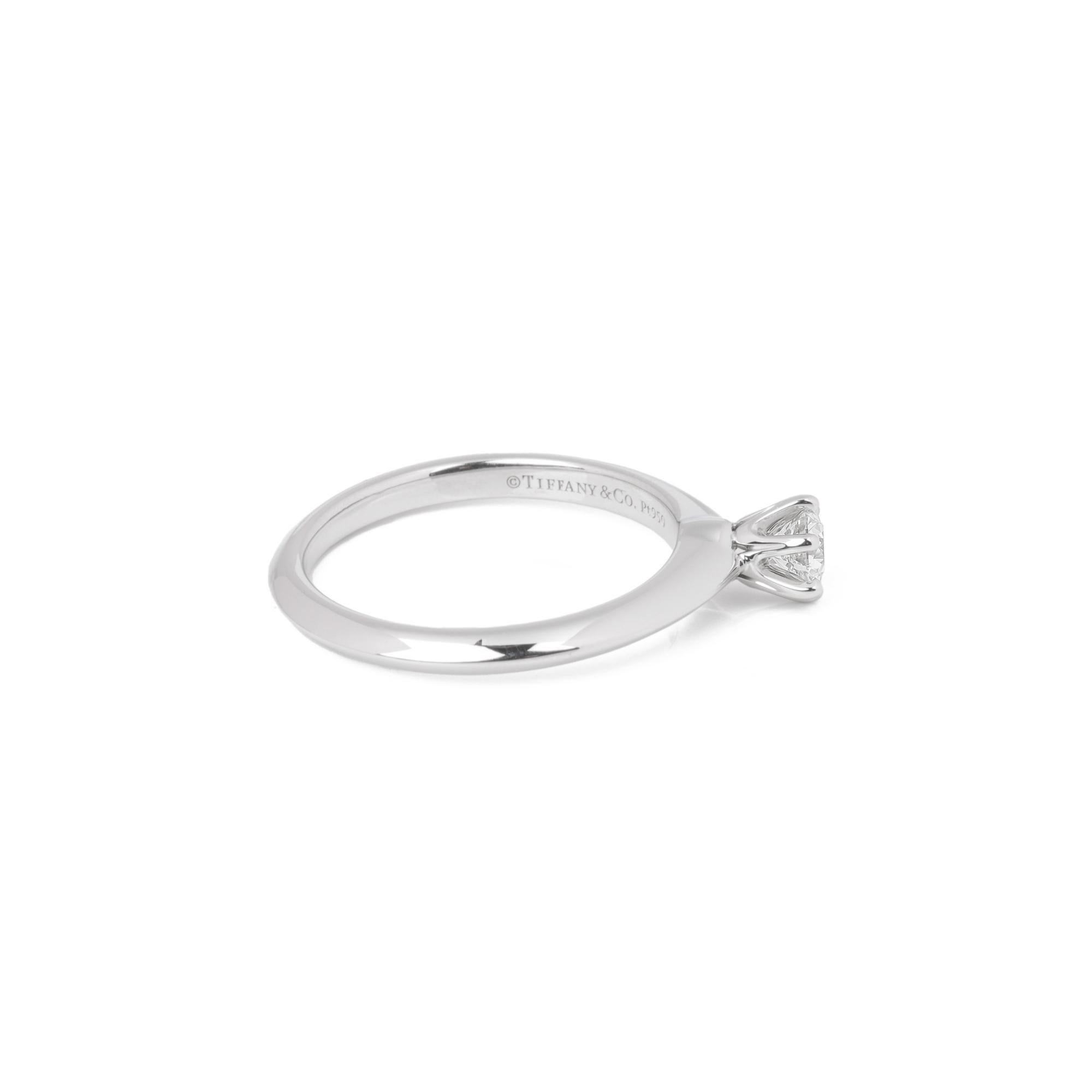 ITEM CONDITION	Excellent
MANUFACTURER	Tiffany & Co.
MODEL	Tiffany Setting
GENDER	Women's
ACCOMPANIED BY	Box and certificate
UK RING SIZE	J
EU RING SIZE	49
US RING SIZE	5
BAND WIDTH	2mm
TOTAL WEIGHT	3.8g
PRIMARY STONE QUANTITY	1
PRIMARY STONE CARAT