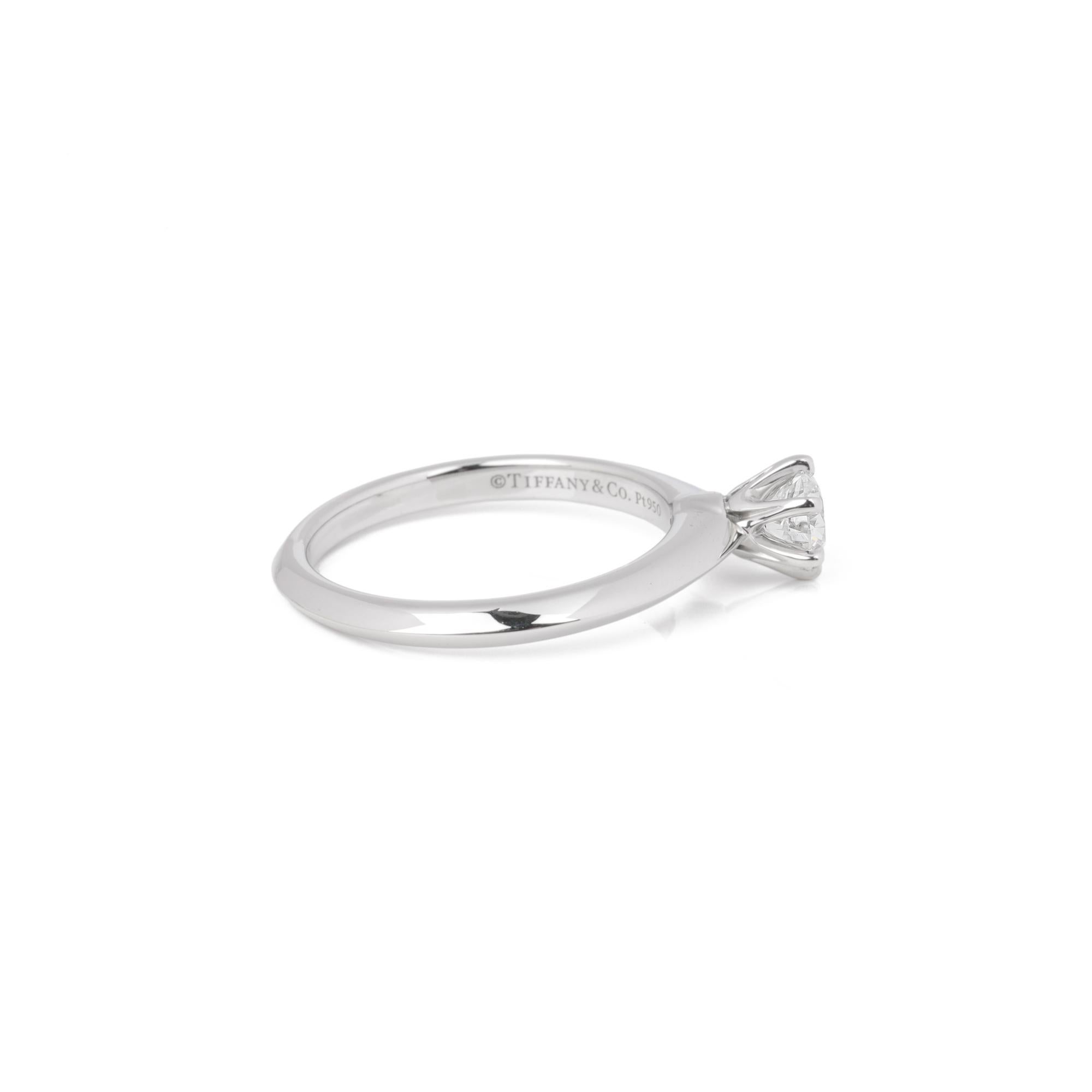 ITEM CONDITION	Excellent
MANUFACTURER	Tiffany & Co.
MODEL	Tiffany Setting
GENDER	Women's
ACCOMPANIED BY	Box and certificate
UK RING SIZE	J
EU RING SIZE	49
US RING SIZE	5
BAND WIDTH	2mm
TOTAL WEIGHT	4g
PRIMARY STONE QUANTITY	1
PRIMARY STONE CARAT