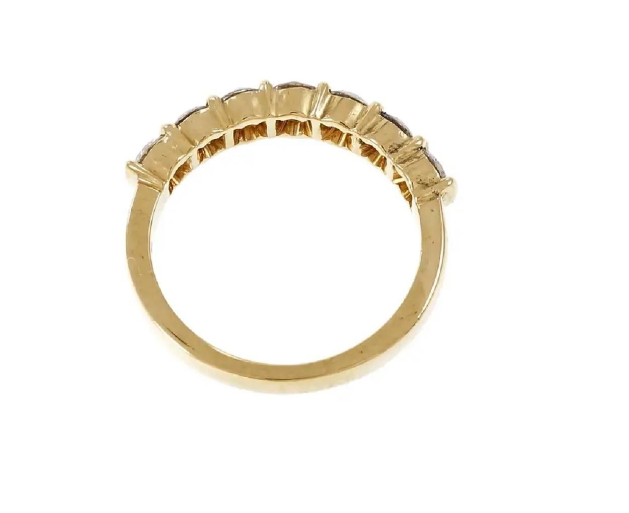 Brand :Tiffany & co
Condition :Pre-owned
Gender:  Women
Metal: 18K yellow gold
Ring Size: 7 (Sizable)
Weight: 3.5gr
Width: 2.0
Carat weight: 0.70ct
Diamond color: F
Diamond clarity: VS
Number of diamonds :7
Diamond shape: Round