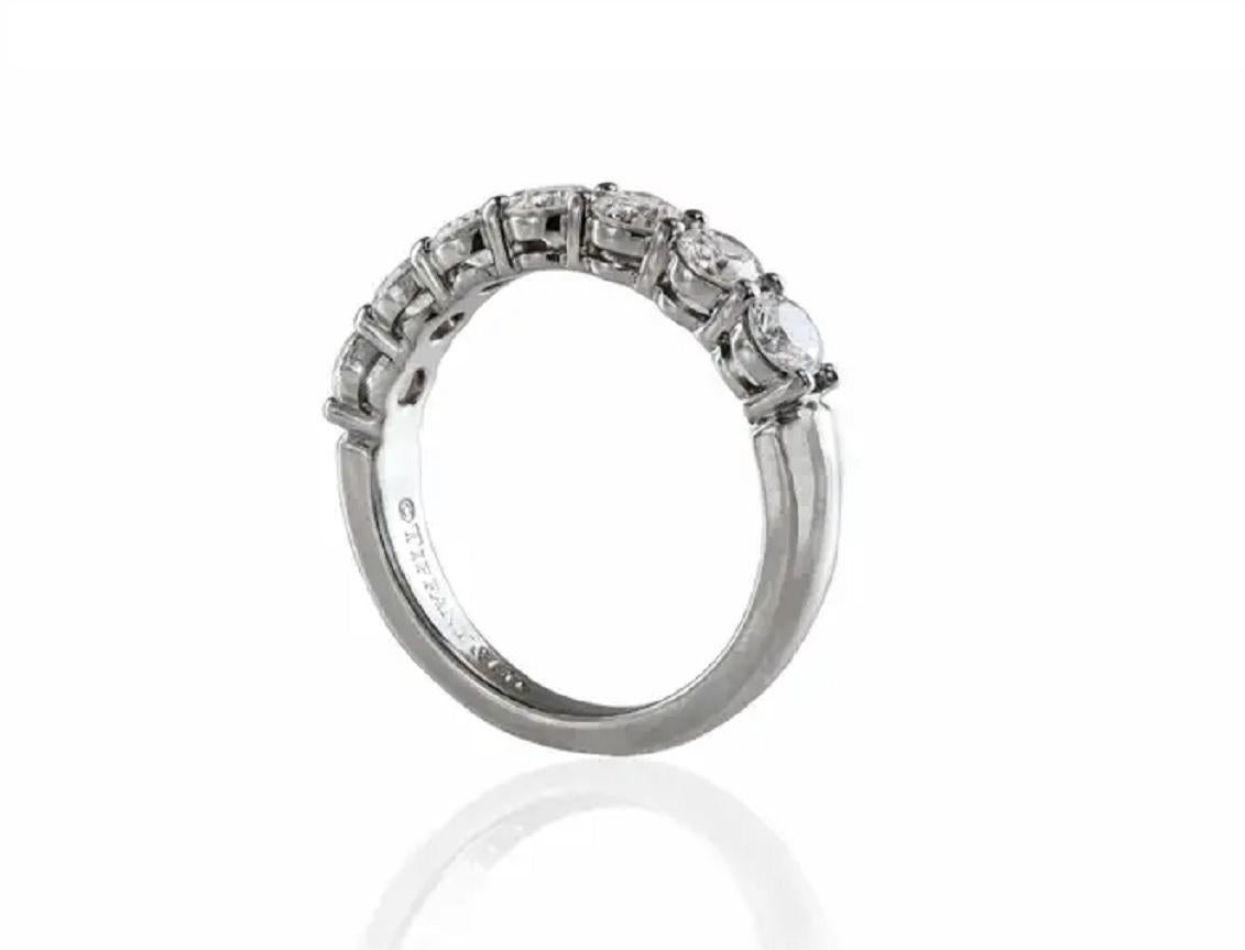 Brand: Tiffany & co
Condition: Pre-owned
Gender: women
Metal: platinum
Ring size: 7 ( Sizable)
Ring weight: 4.8gr
Width :1.9mm
Carat weight: 0.65ct
Diamond Clarity: VVS2-VS1
Diamond color: E-F
Number of diamonds 7
Diamond Shape: Round
Current