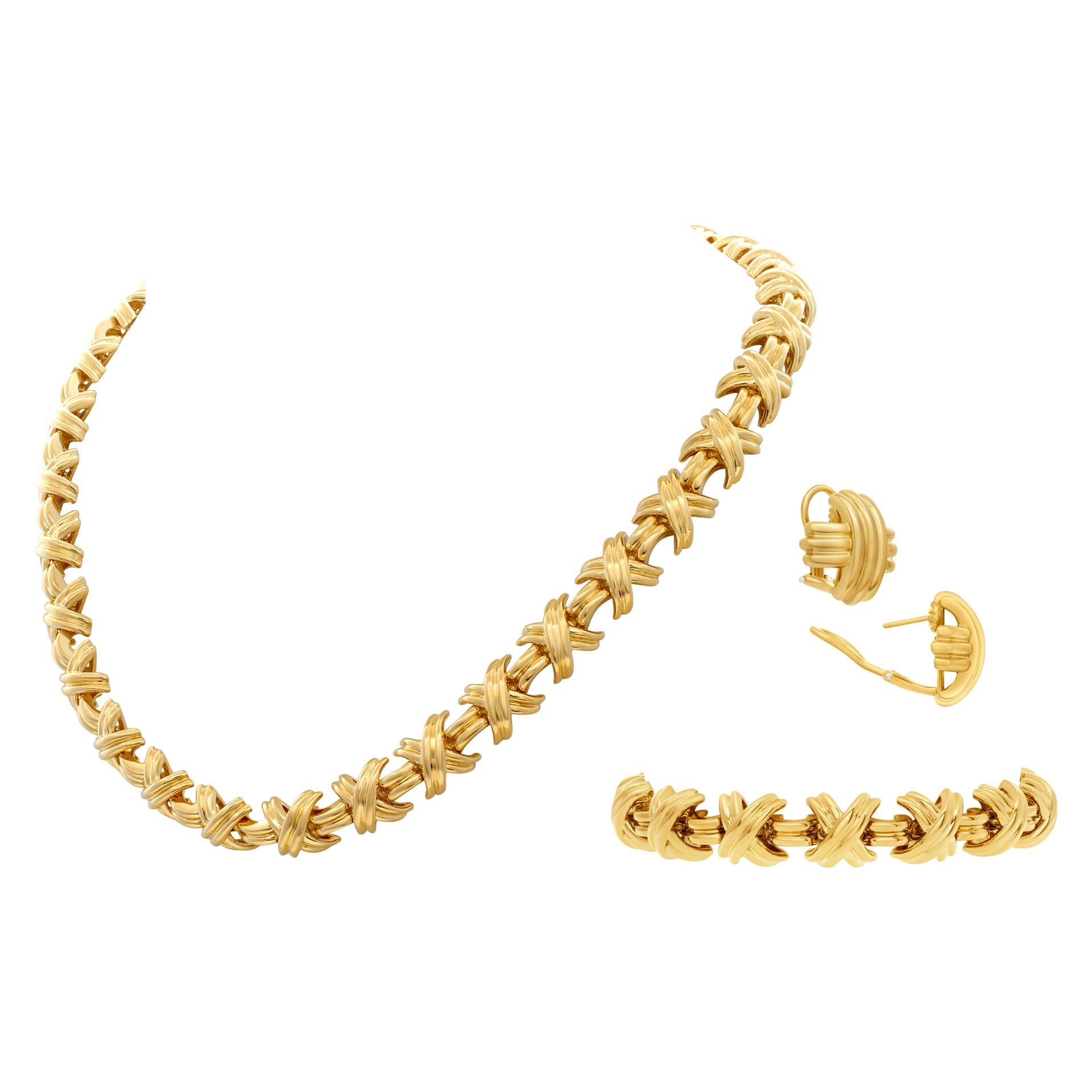ESTIMATED RETAIL: $42,50.00 YOUR PRICE: $21,000 - Tiffany & Co. Signature Crossover 3 piece collection in 18k; necklace, bracelet & earrings. Necklace length x width: 17