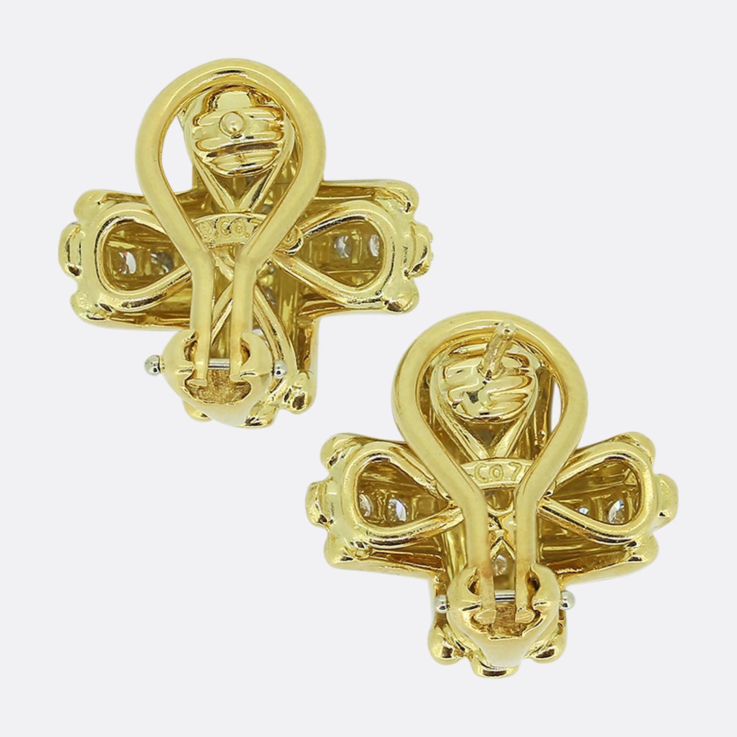 Here we have a classic pair of 18ct yellow gold earrings from the world renowned jewellery designer, Tiffany & Co. These earrings have been crafted into the shape of Tiffany's iconic X design and set with sparkling round brilliant cut diamonds. They