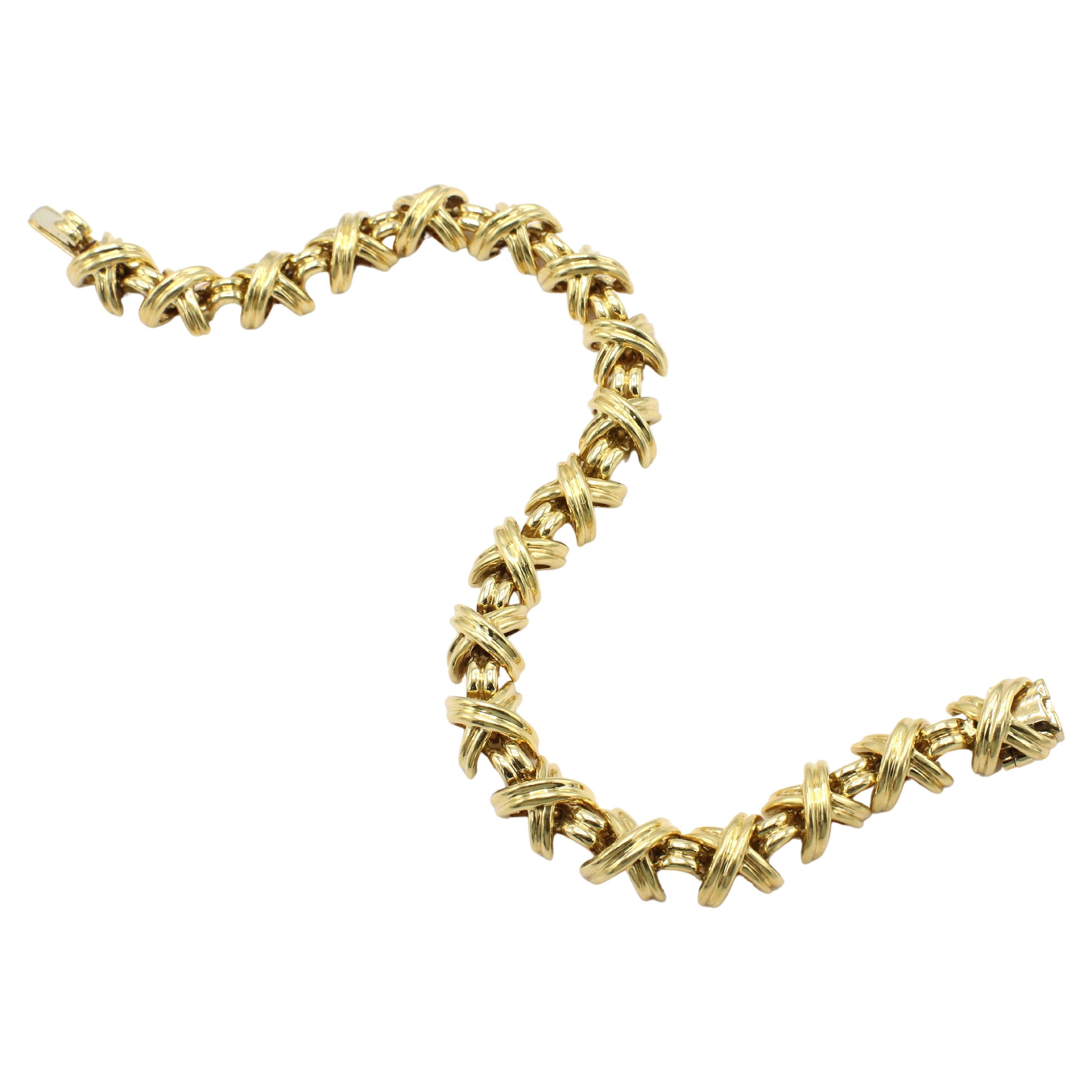 Tiffany & Co. Signature X 18 Karat Yellow Gold Link Bracelet 
Metal: 18k yellow gold
Weight: 30.38 grams
Length: 7 inches
Width: 6.5mm
Signed: © T&Co. 750
