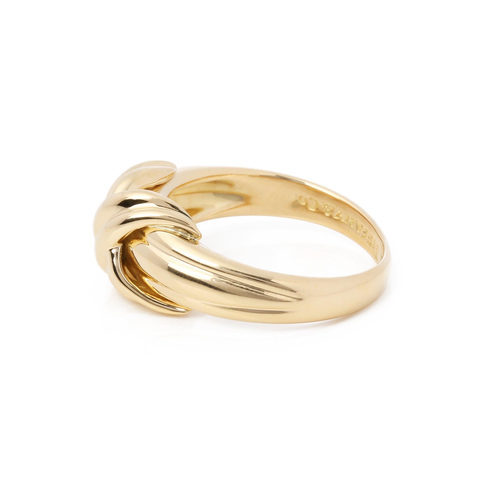 This ring by Tiffany & Co is from their signature X Kiss collection and made in 18k yellow gold. UK ring size K 1/2. EU ring size 51. US ring size 5 1/2. Accompanied with a Xupes presentation box. Our Xupes reference is J705 should you need to quote